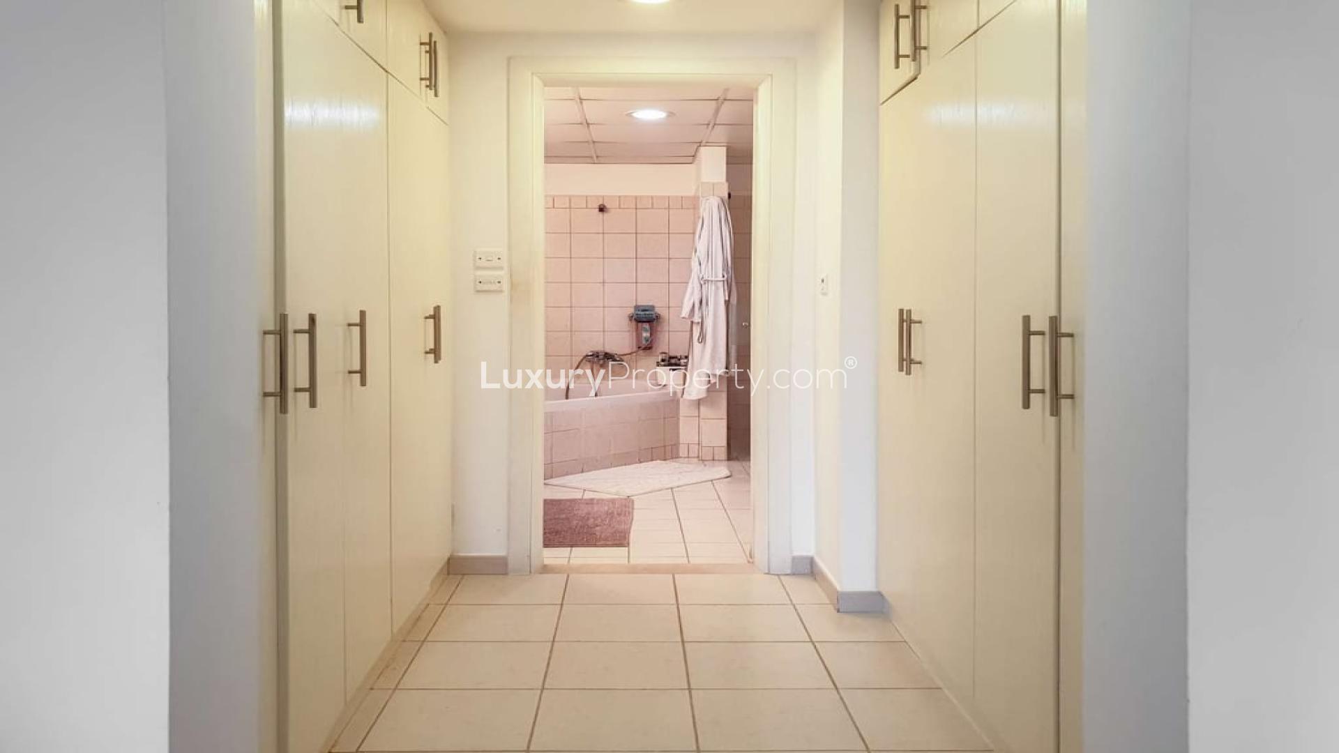 Luxurious living room in five-bedroom villa, Meadows 2, featuring elegant decor and natural light