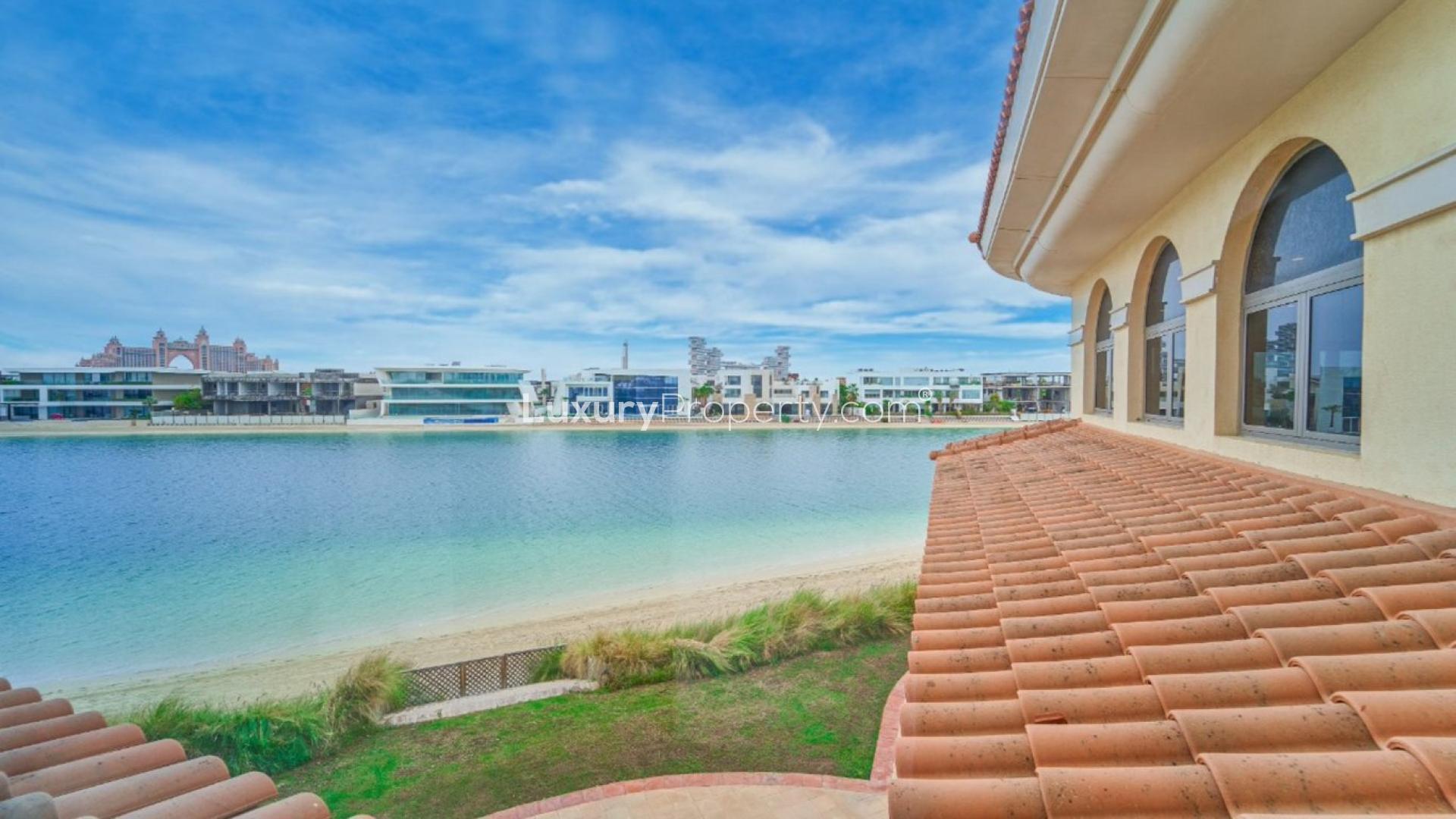 Luxurious open-plan living area in Palm Jumeirah villa with large windows and marble floors