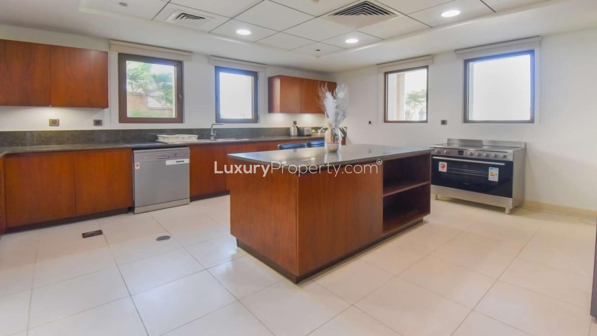 Outdoor patio of Balqis Residences Villa, Palm Jumeirah, with seating and ocean view