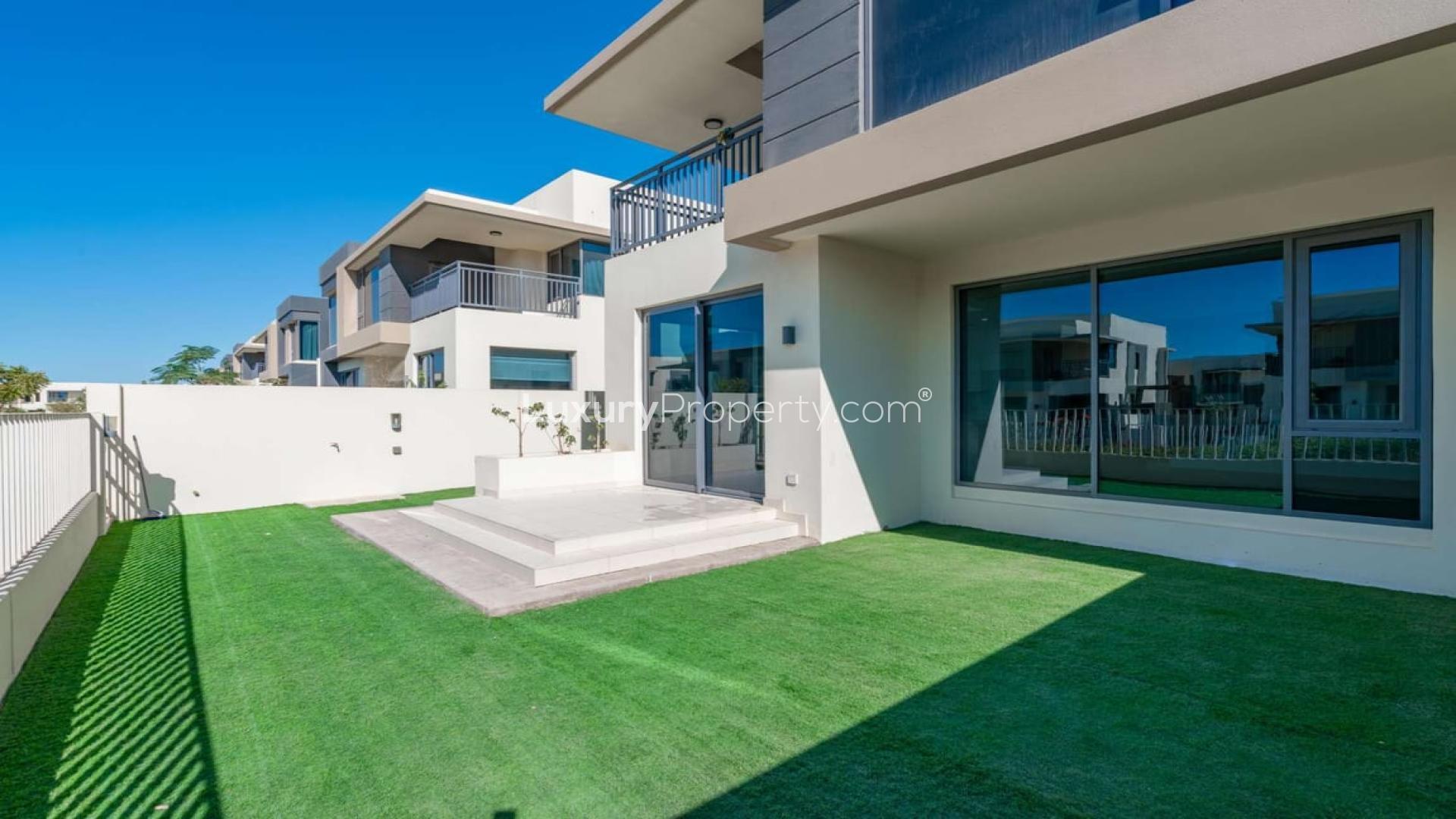 Spacious villa interior with large windows and garden views at Maple, Dubai Hills Estate