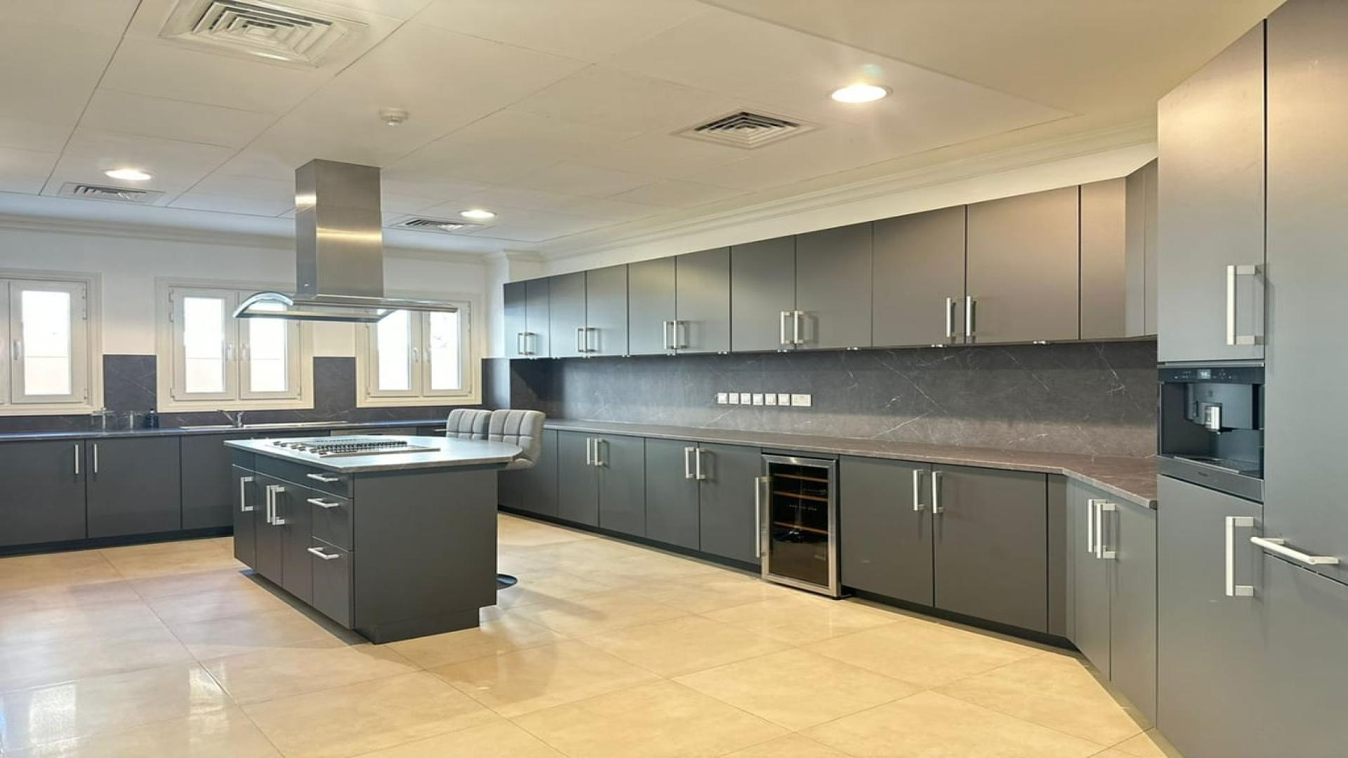 Spacious living area in Sienna Lakes Villa, Jumeirah Golf Estates, with elegant marble flooring