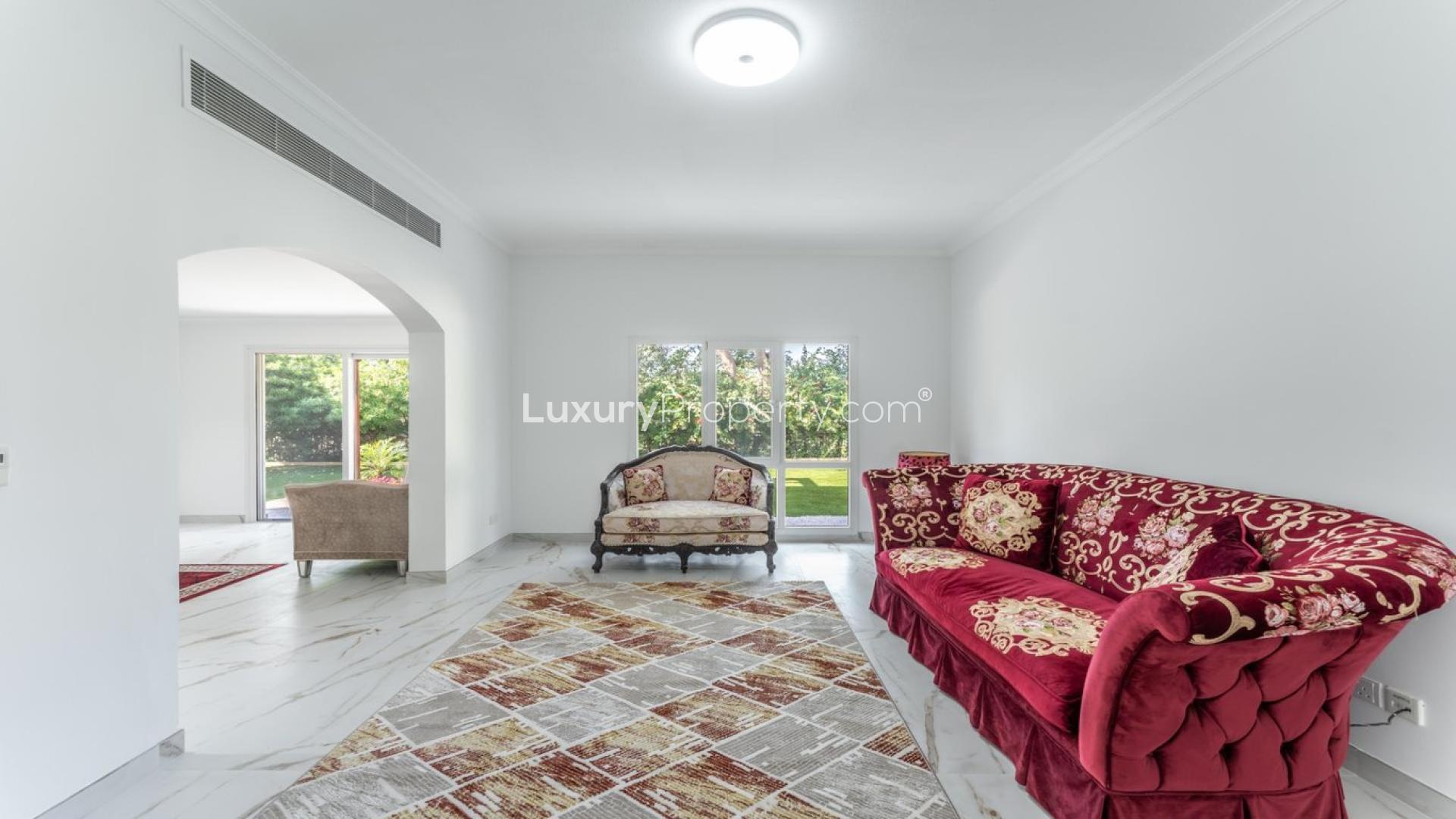 Luxurious living room in 5-bedroom villa for rent, Meadows 6, with garden view