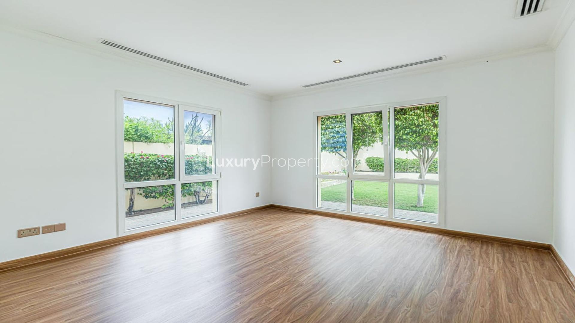 Spacious living area in 5-bedroom villa for rent, Meadows 4, with modern wooden flooring