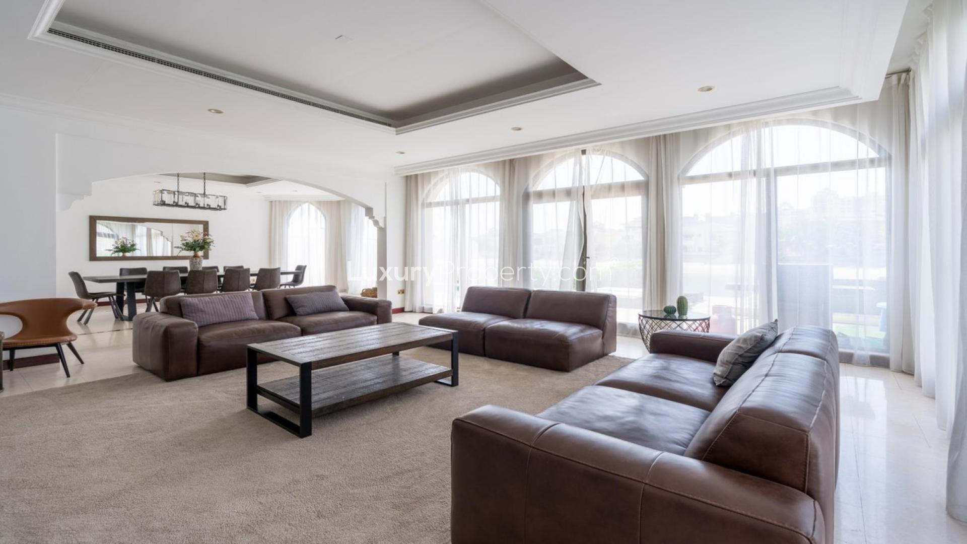 Luxurious living room in Palm Jumeirah villa with garden and water views