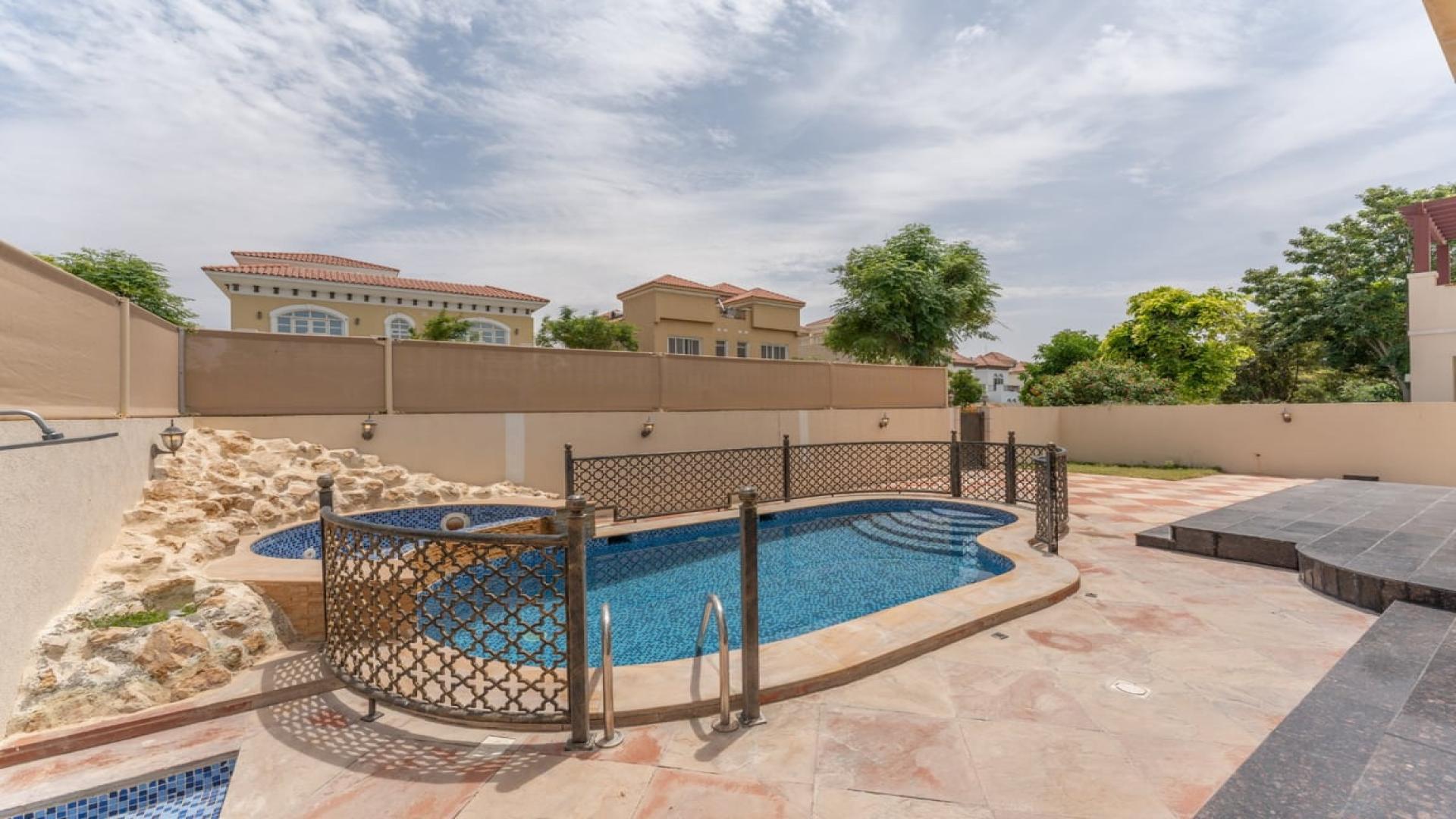 Corner villa exterior with private pool in The Aldea, The Villa community