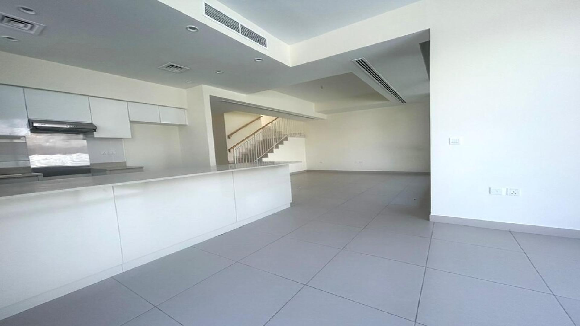 Spacious living area in five-bedroom villa, Maple at Dubai Hills Estate, large windows, modern design