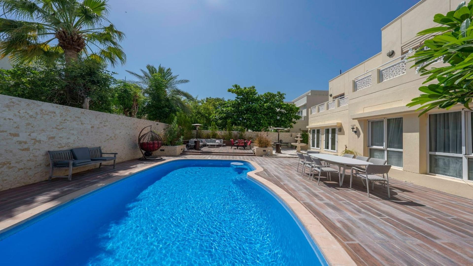 Alt text: "Meadows 2 villa with private pool, spacious patio, lush greenery, fully renovated for rent.",Fully renovated villa with private pool in Meadows 2, ideal for family rental
