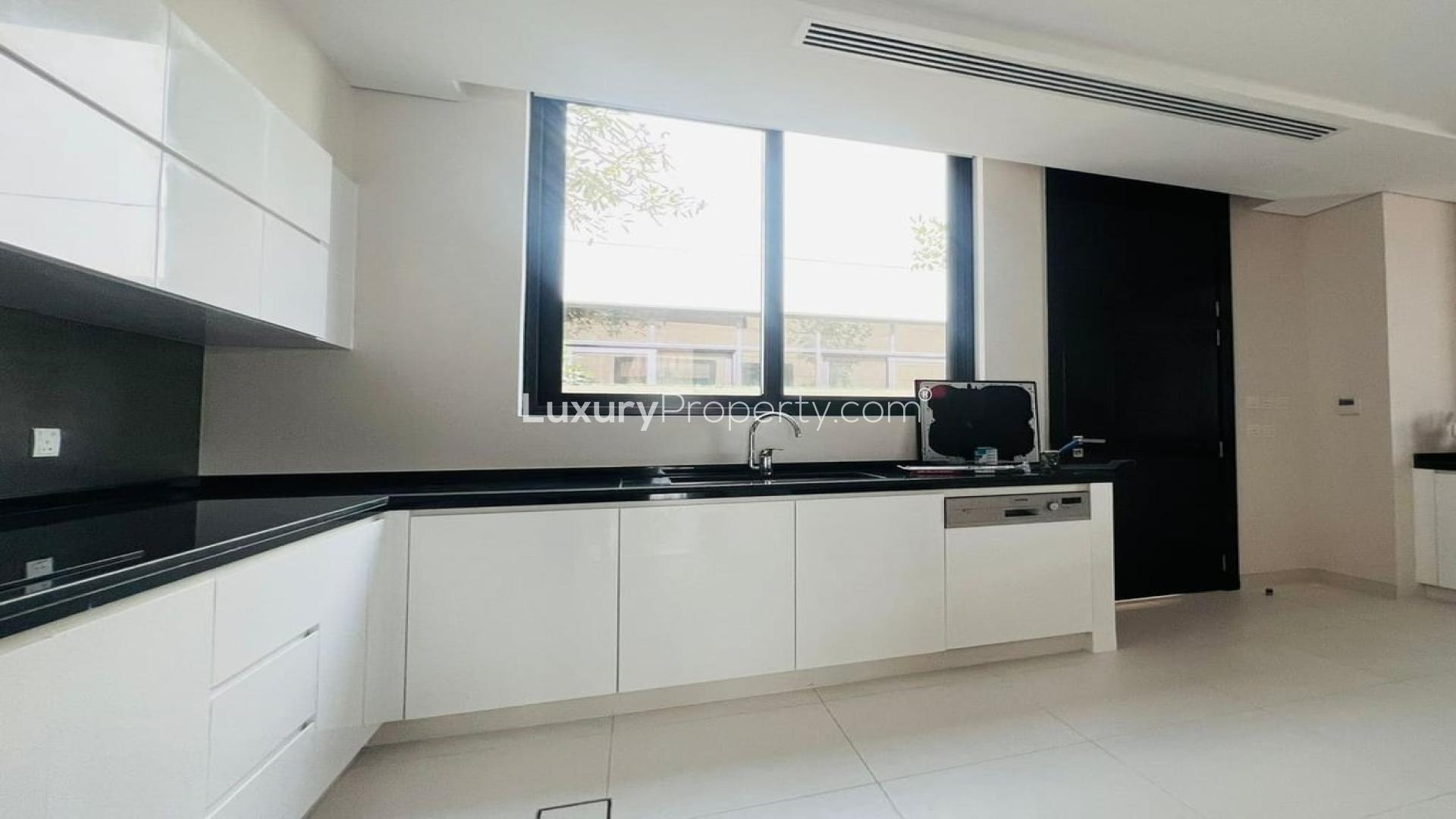 Alt text: "Spacious living area in fully furnished Damac Hills villa, Picadilly Green community, LP41233.",Modern kitchen in a fully furnished 5-bedroom villa, Damac Hills, Picadilly Green