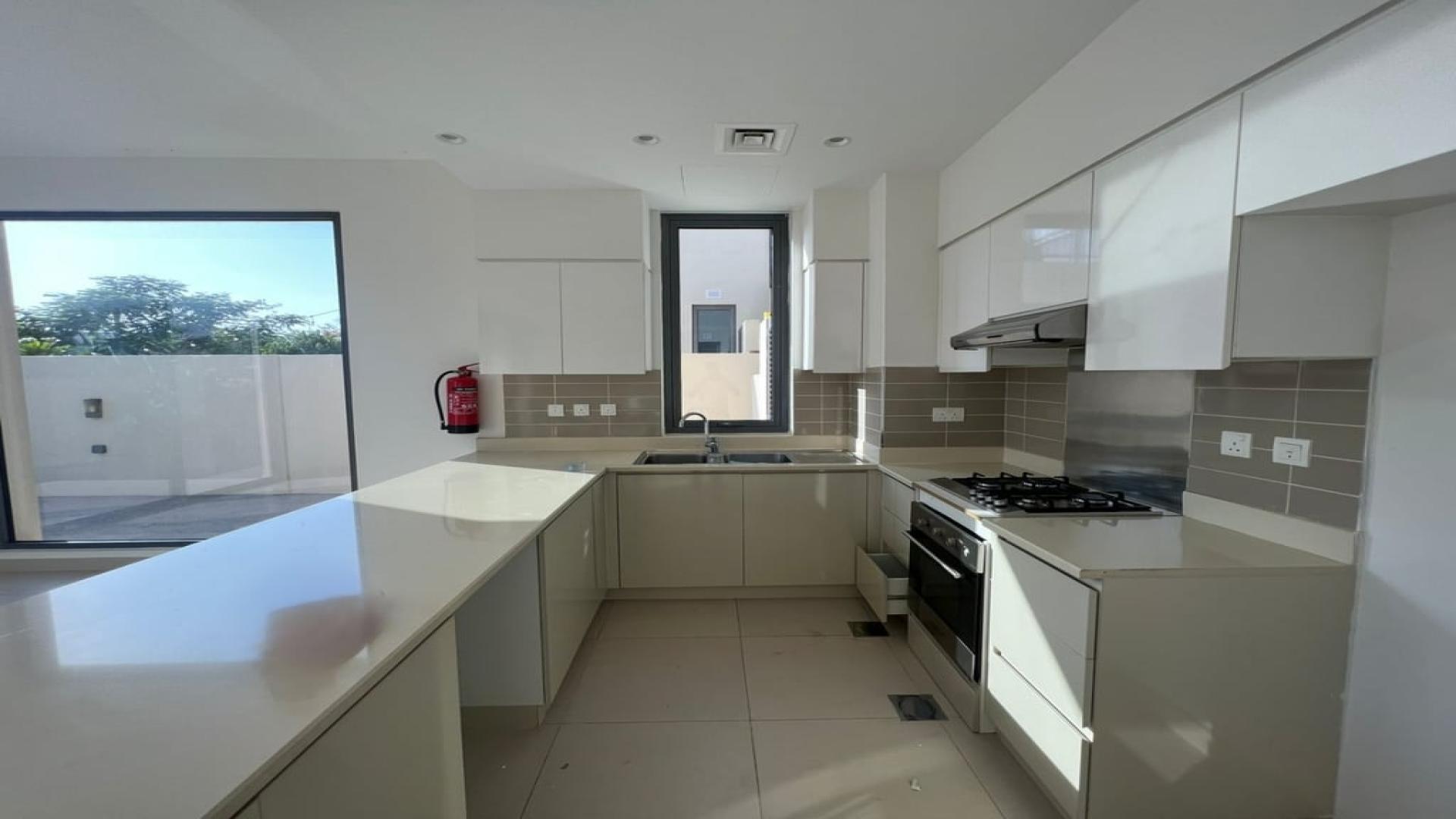 Modern kitchen and living area in Dubai Hills Estate villa for rent, Maple community