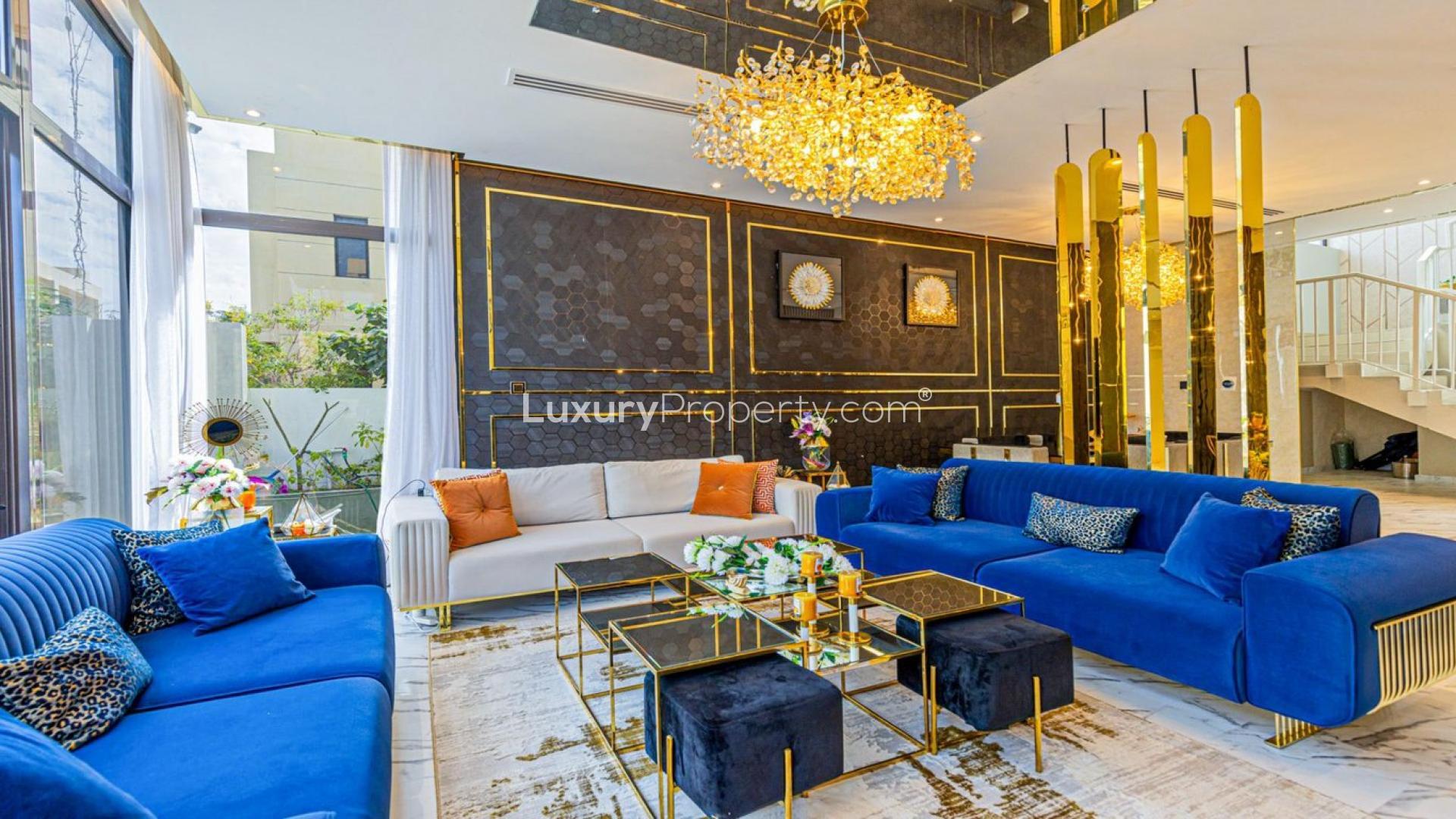 Luxurious living room in upgraded Damac Hills villa, featuring modern decor and elegant lighting