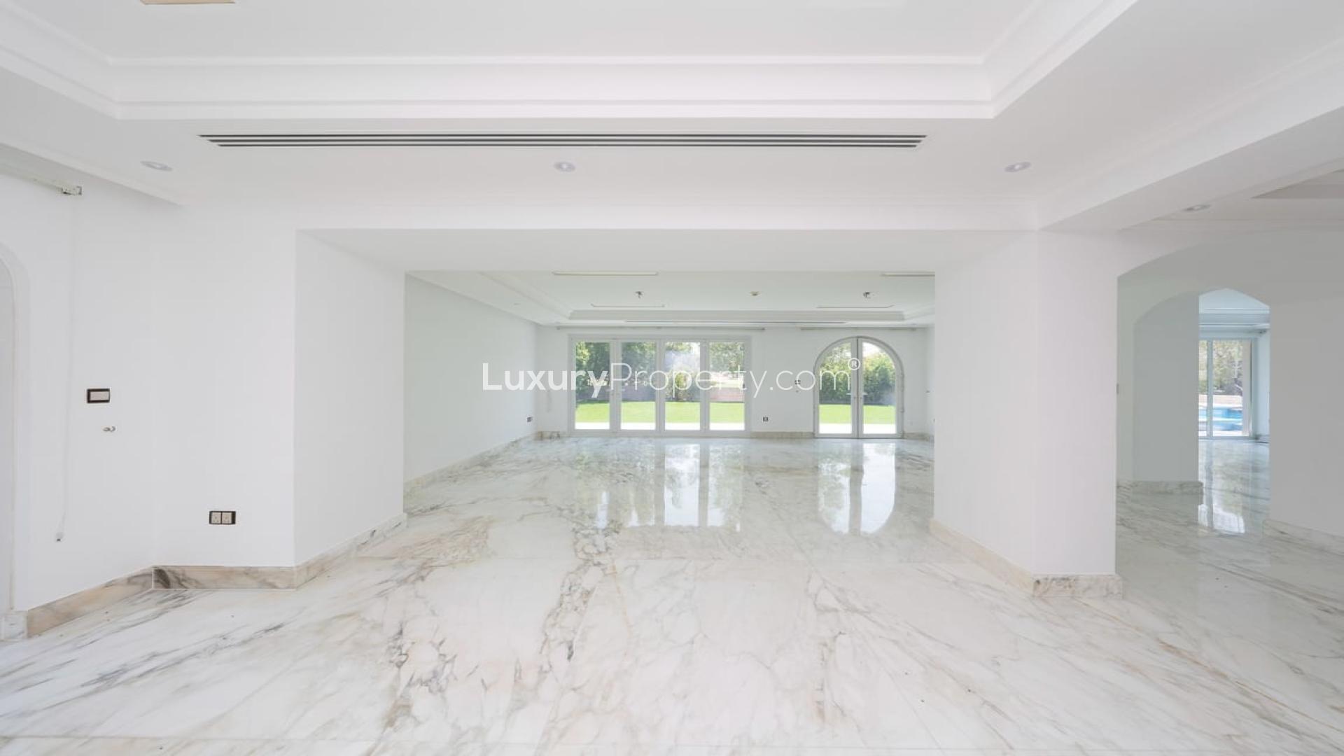 Spacious marble-floored living area in luxury Jumeirah Golf Estates villa for rent