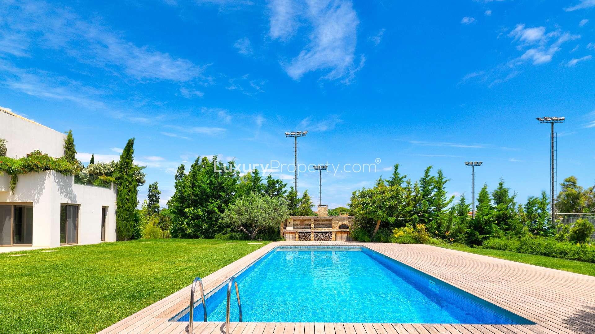 Bright living area in Rafina villa with garden view and modern design elements