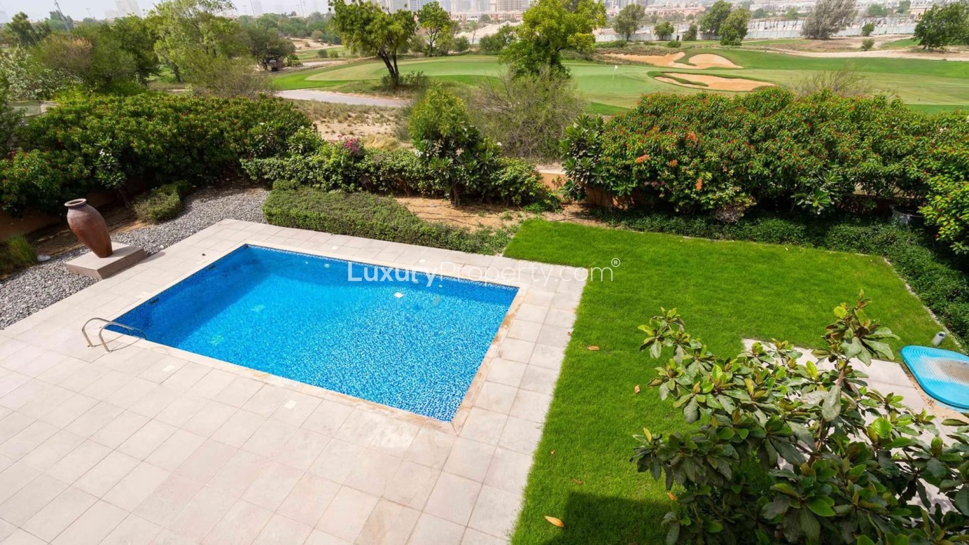 Luxurious villa pool and garden overlooking golf course at Jumeirah Golf Estates, Fire community