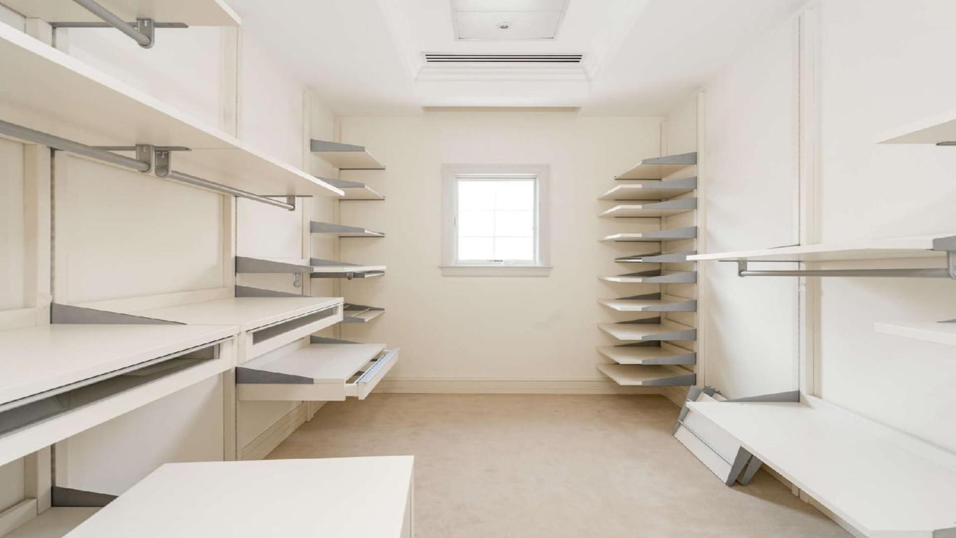 Bright living room with marble floors and large windows in Jumeirah Golf Estates villa