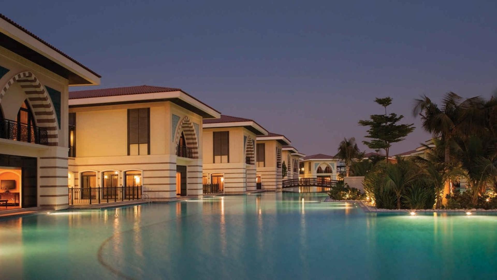 Sea-facing villa view with palm trees and beach at Jumeirah Zabeel Saray, Palm Jumeirah