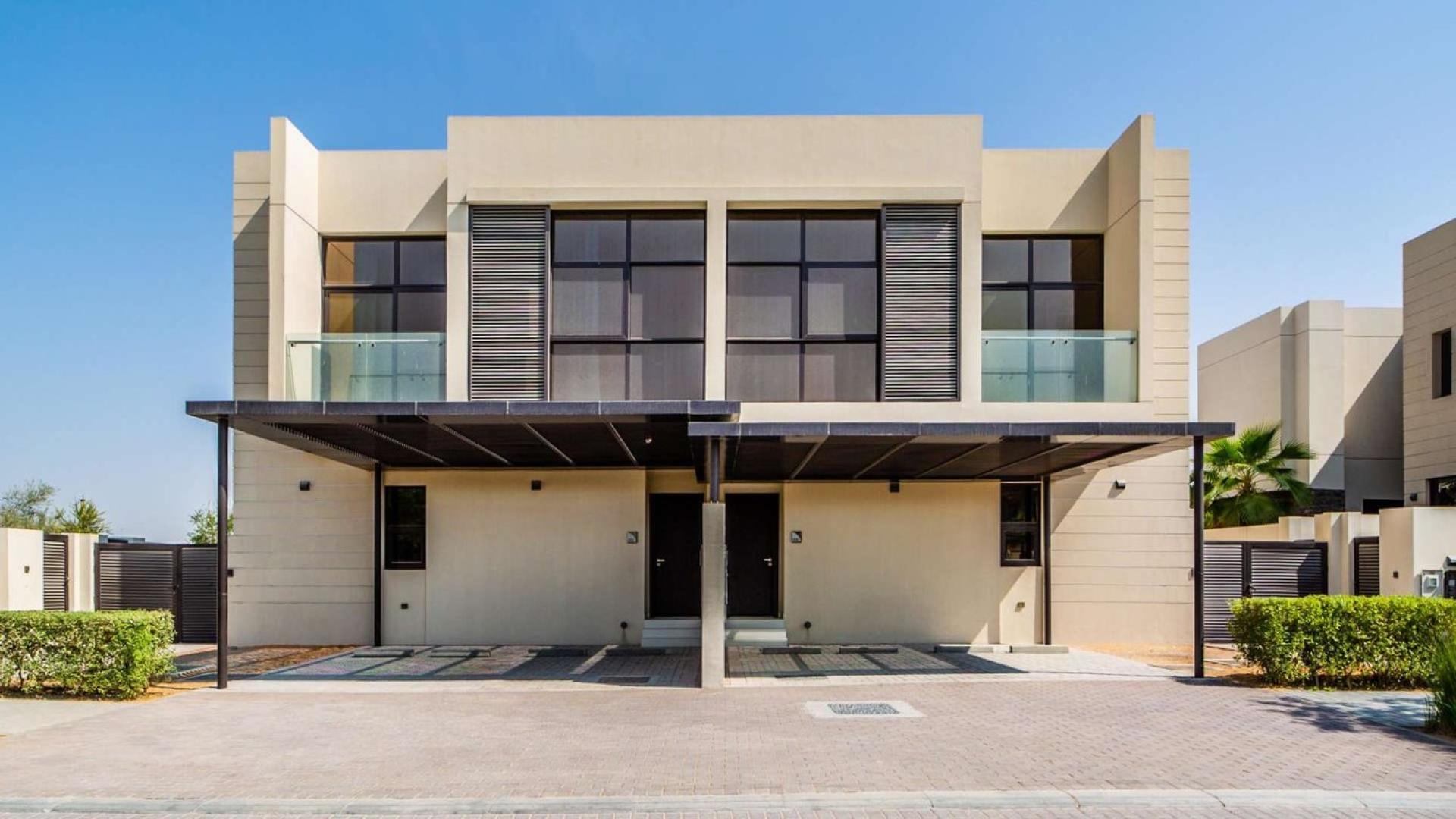 Luxurious living room in 5-bedroom Paramount Villa, Damac Hills, with modern decor and large windows