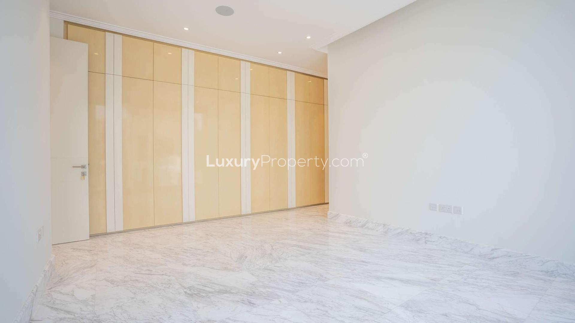 Interior view of luxury Palm Jumeirah villa kitchen with marina views and open design