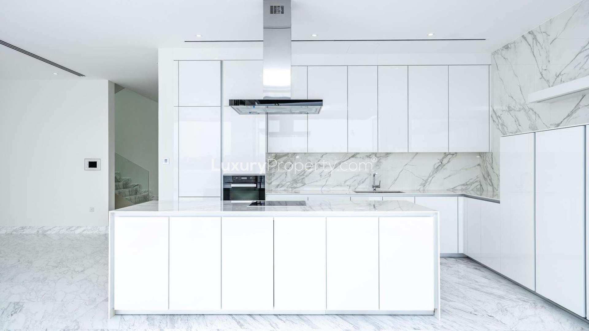 Luxurious open-plan living area in Palm Jumeirah villa with marina views, marble flooring