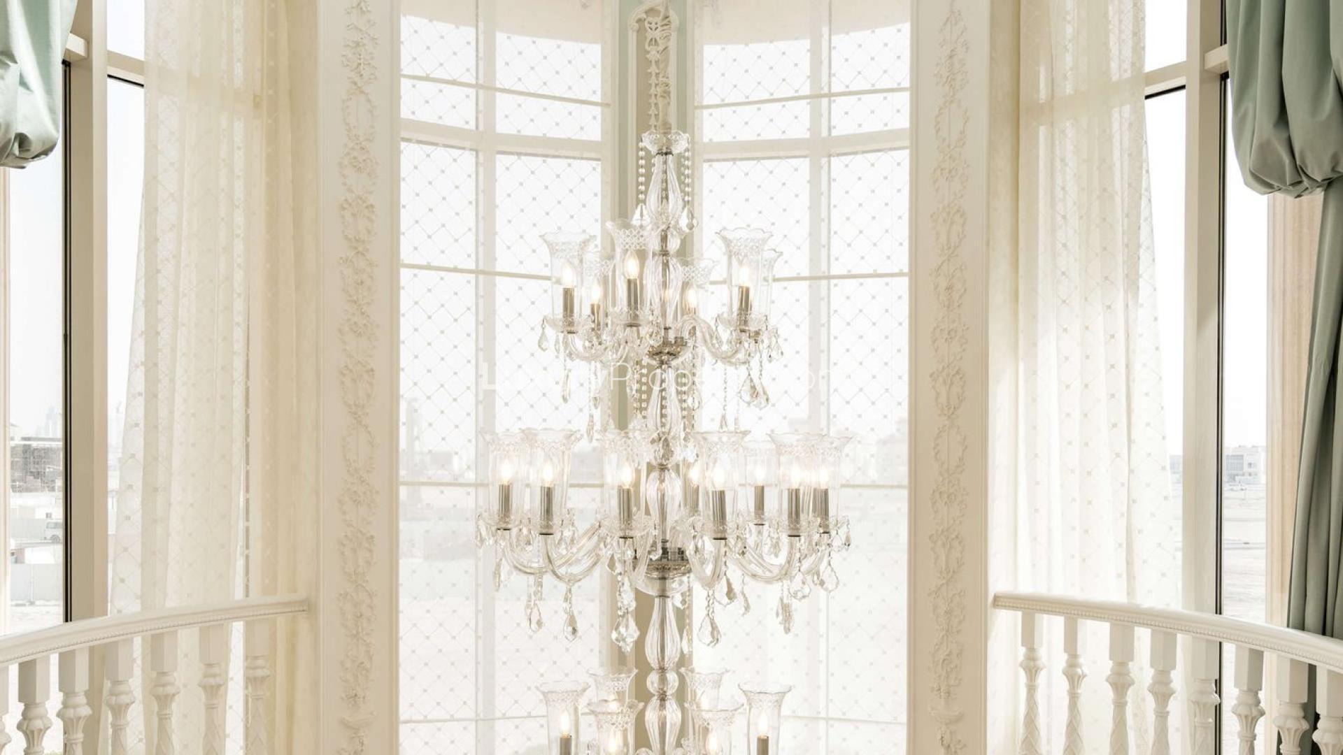 Luxurious villa interior with elegant staircase and chandelier in Pearl Jumeirah, Dubai