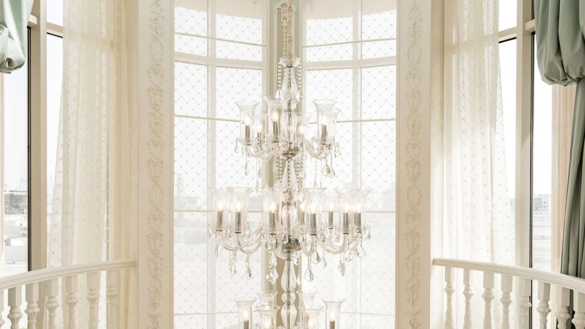 Luxurious villa interior with elegant staircase and chandelier in Pearl Jumeirah, Dubai