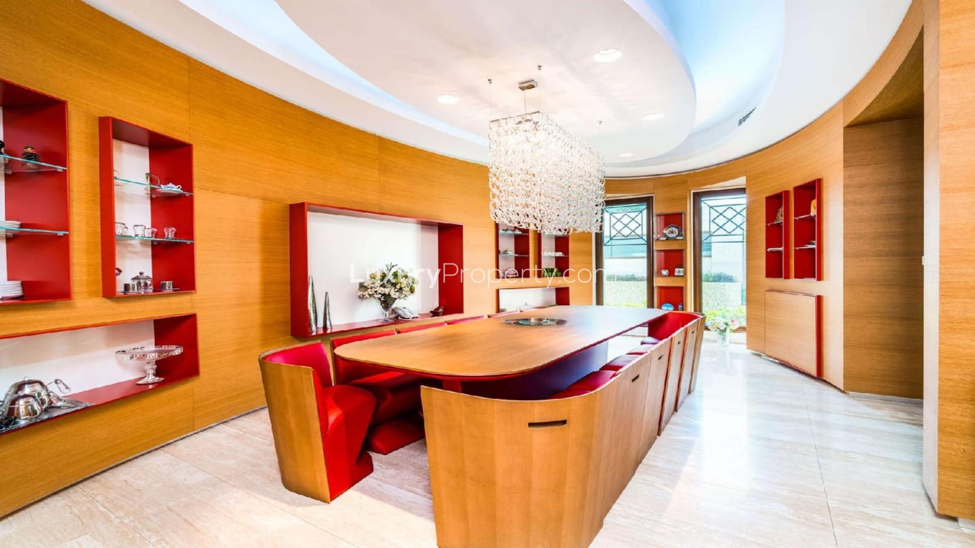 Luxurious staircase with glass railings in Emirates Hills villa, Sector R, for rent