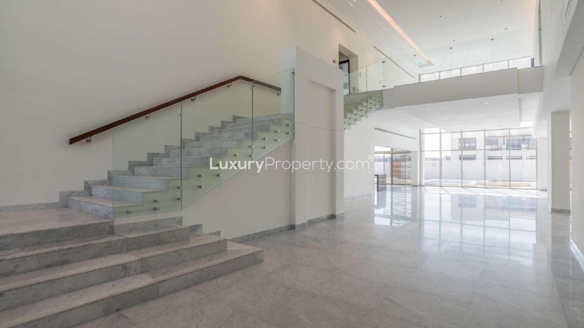 Spacious modern villa interior with marble floors and large windows in District One, Dubai