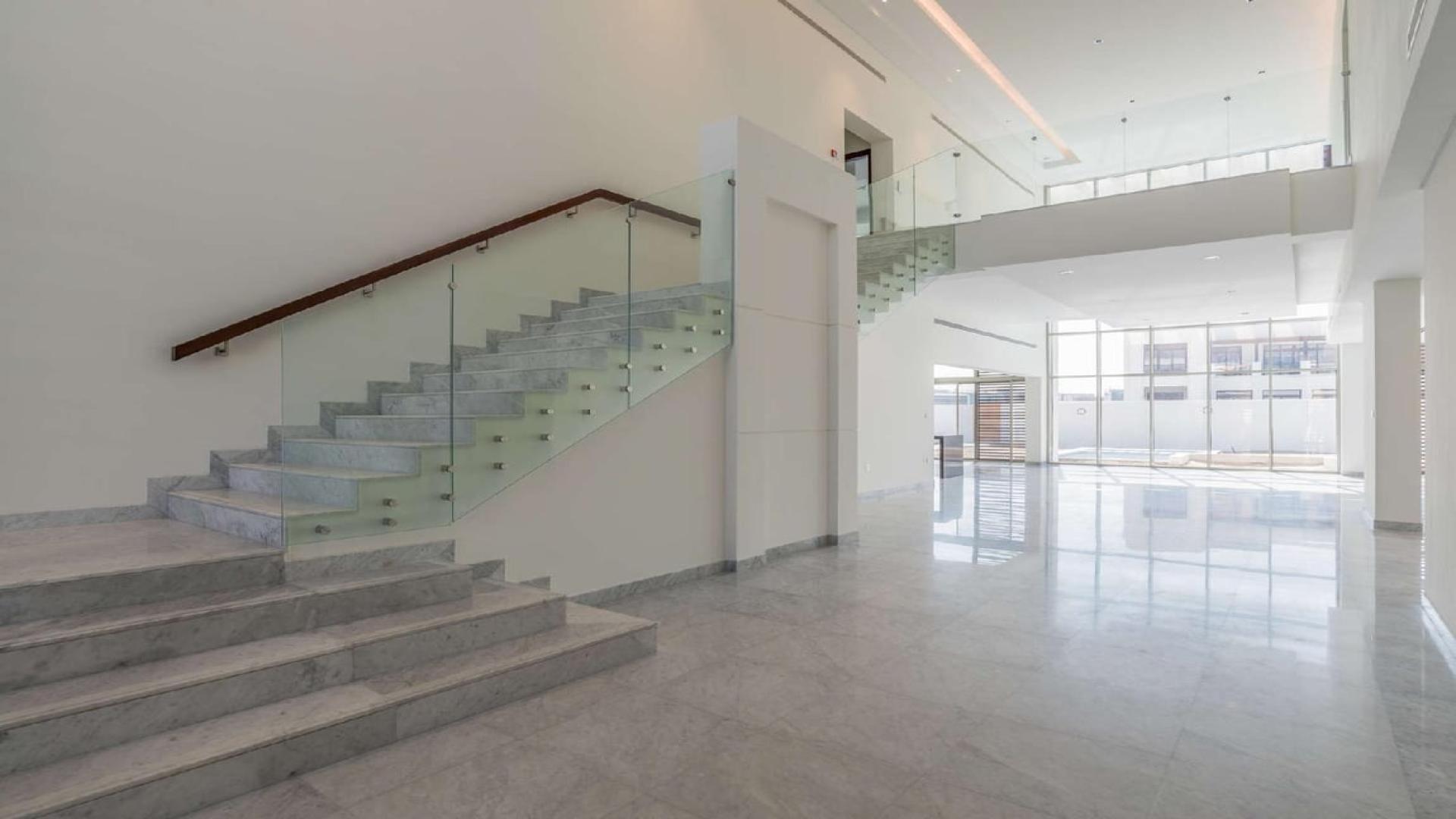 Spacious modern villa interior with marble floors and large windows in District One, Dubai