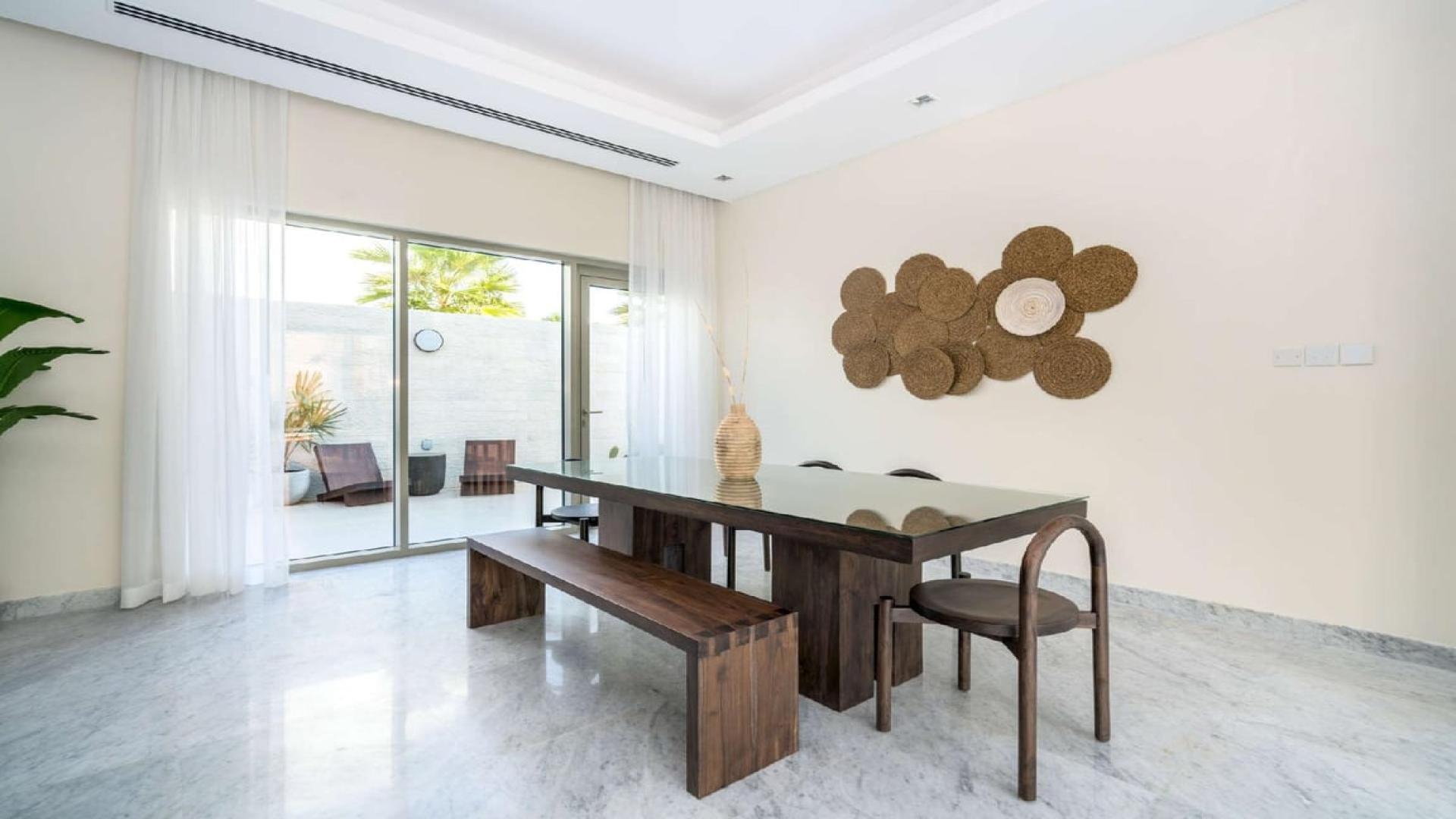 Luxury villa living room with modern decor and large windows in District One, Dubai