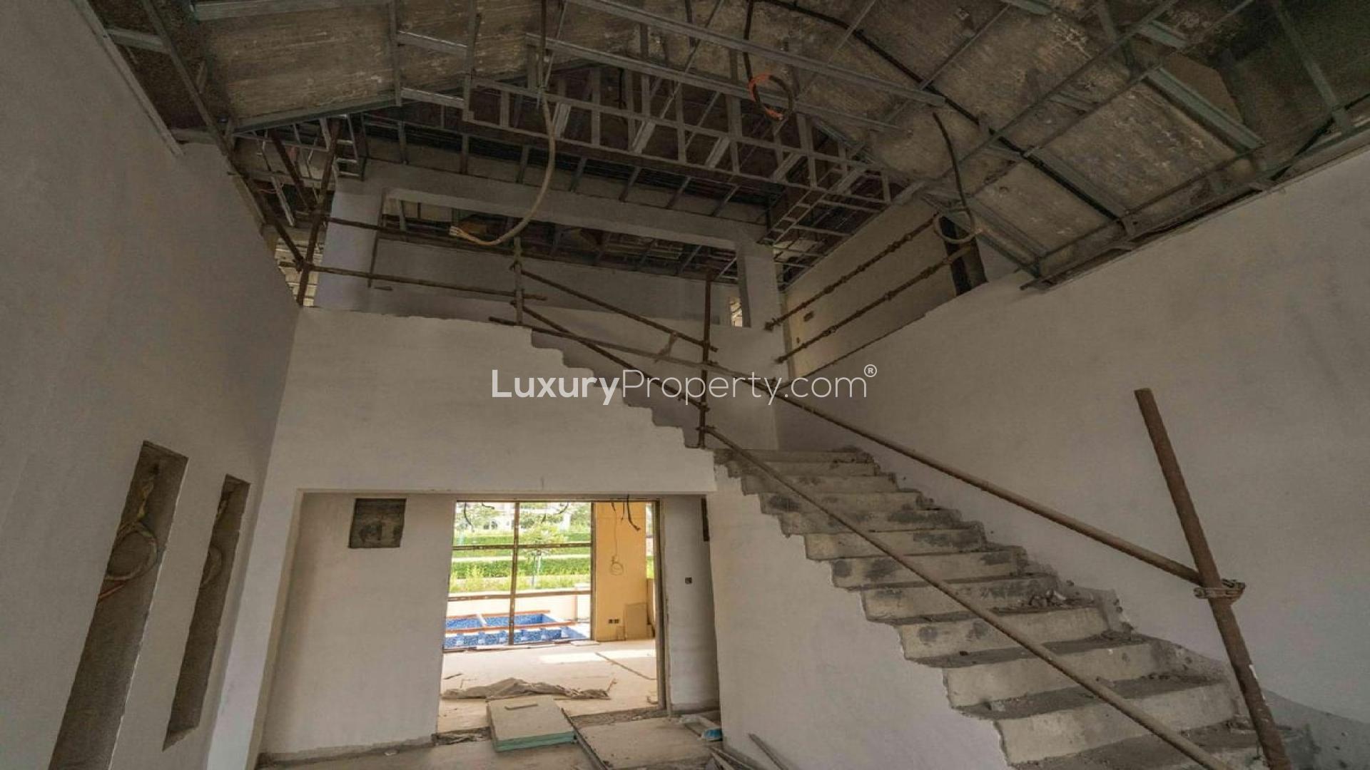 Shell and core villa exterior at Sanctuary Falls, Jumeirah Golf Estates, for sale