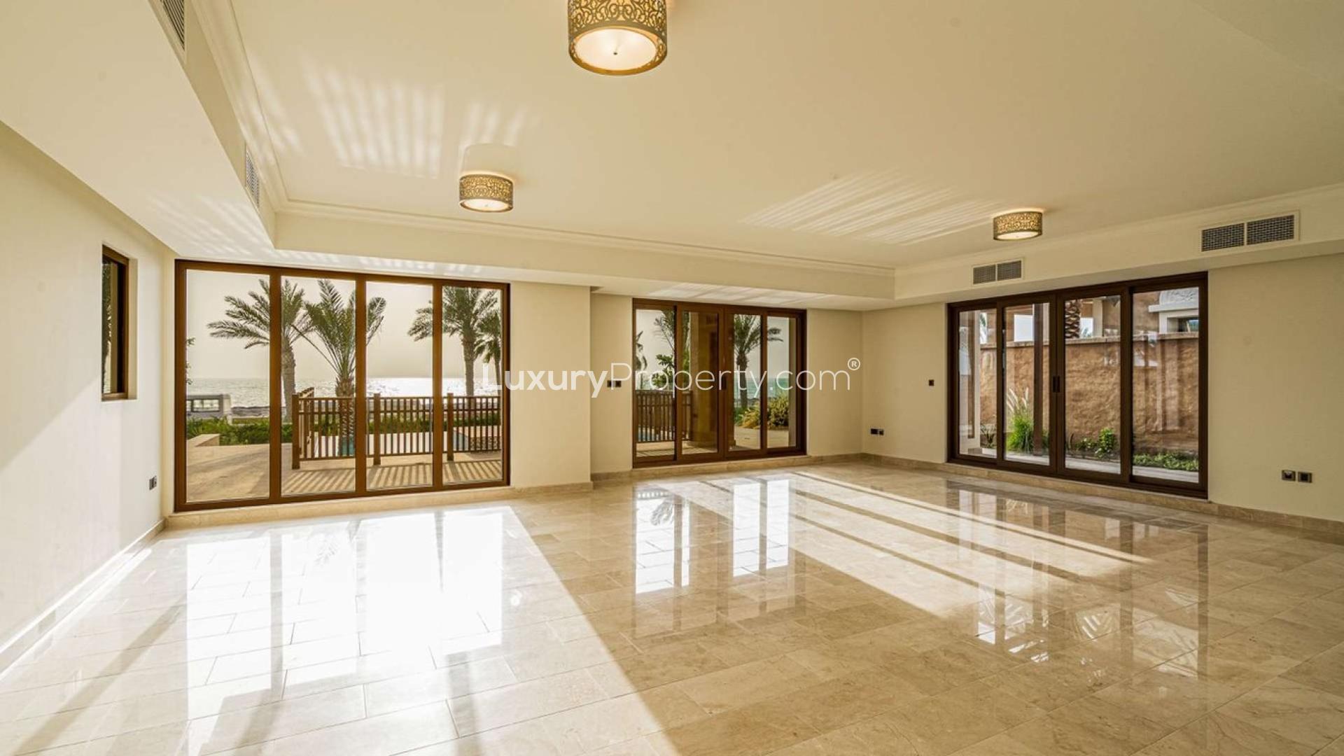 Spacious living room with ocean view in Palm Jumeirah beachfront villa for sale