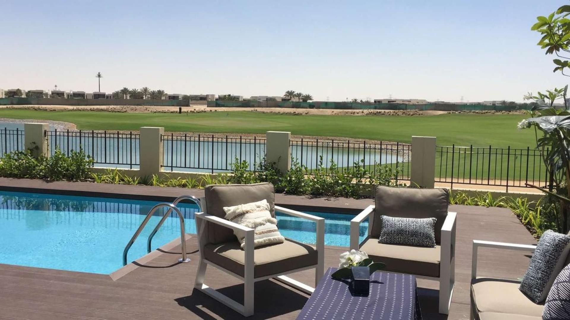 Luxurious villa patio with pool and golf course view in The Flora, Damac Hills