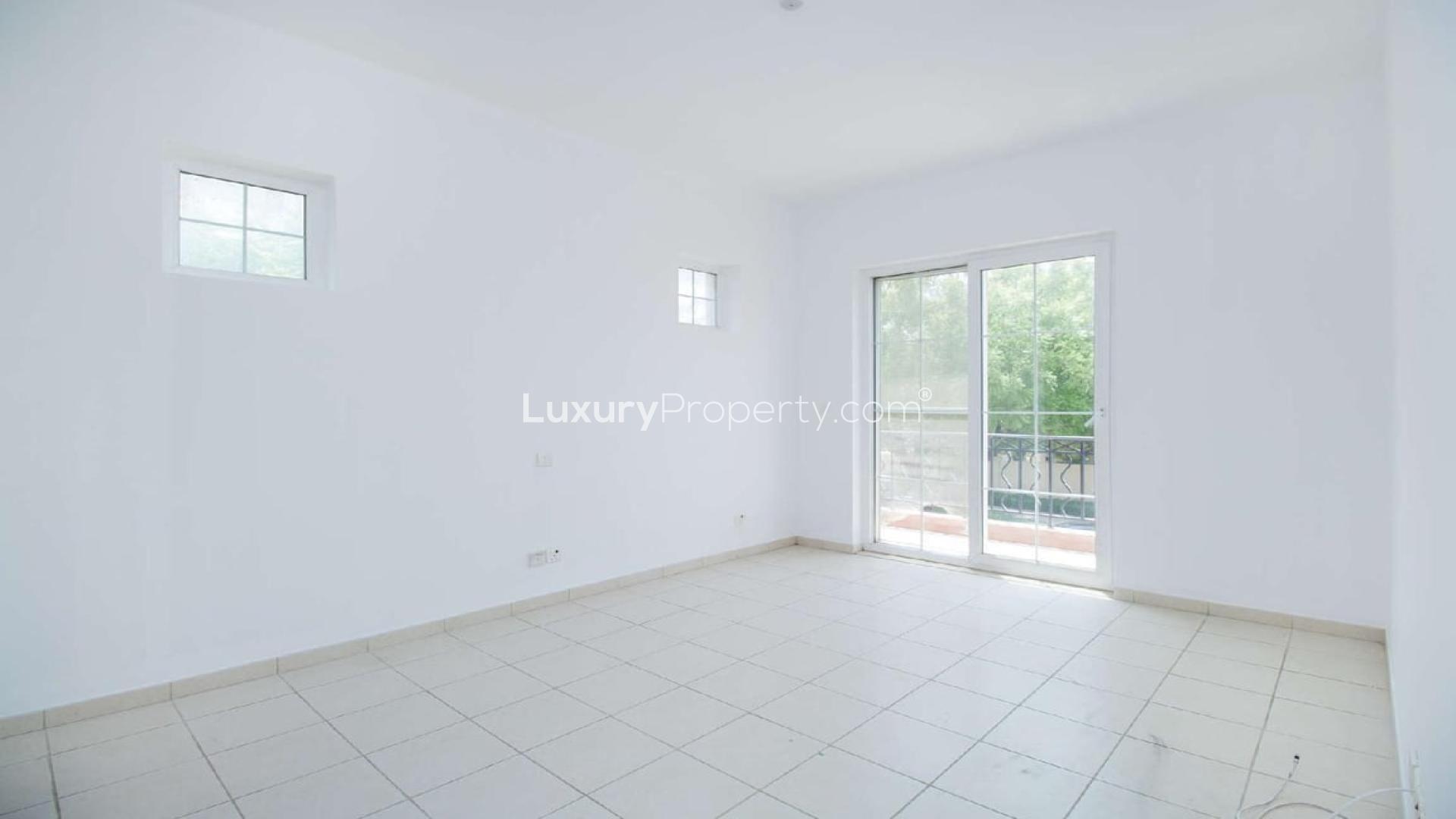 Spacious living room with fireplace in Mirador villa, Arabian Ranches for sale