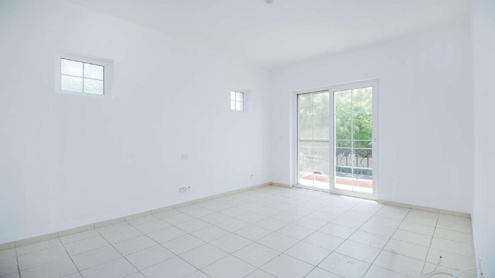 Spacious living room with fireplace in Mirador villa, Arabian Ranches for sale