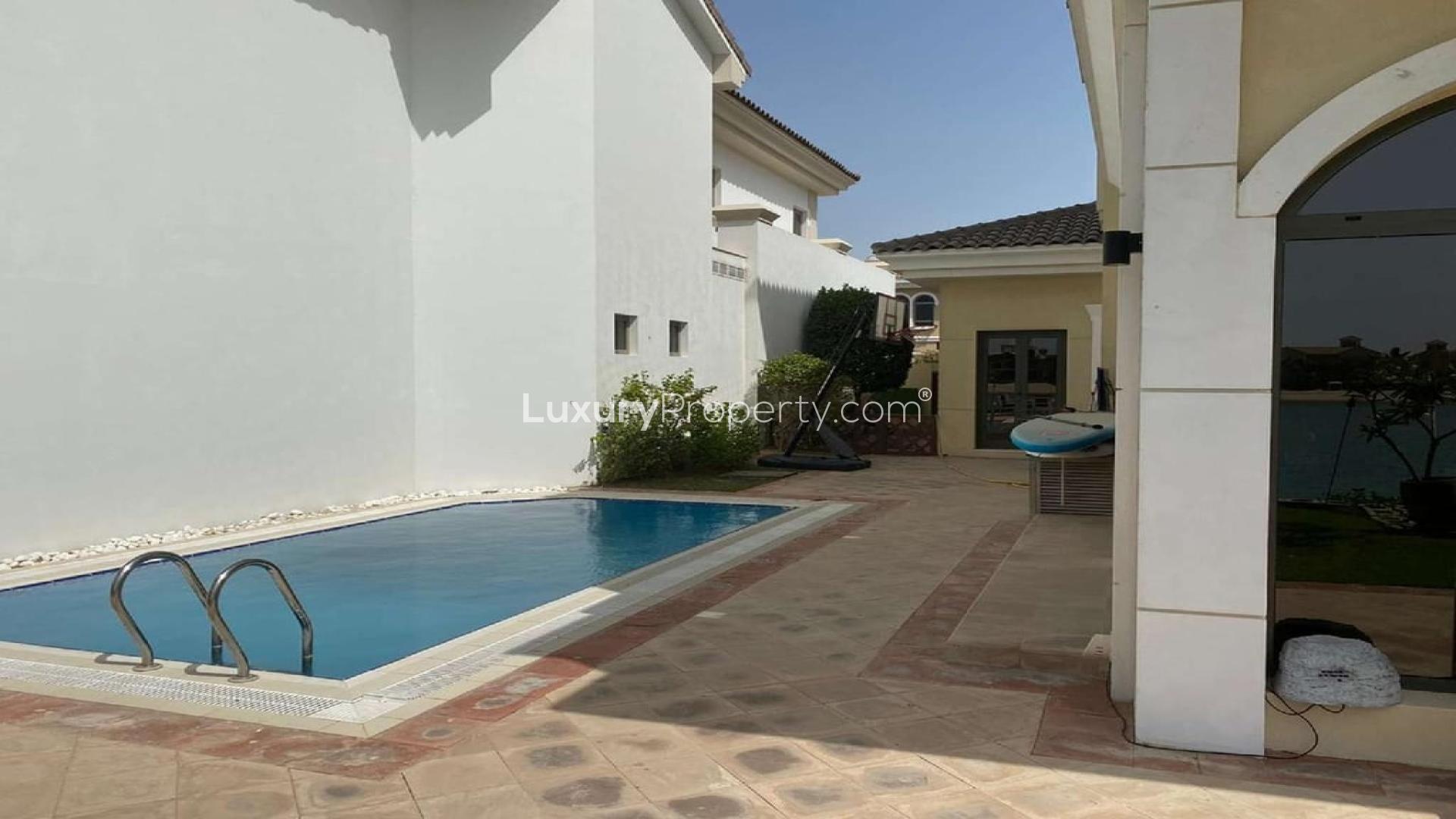 Elegant 5-bedroom villa exterior with garden on Palm Jumeirah, Garden Homes community