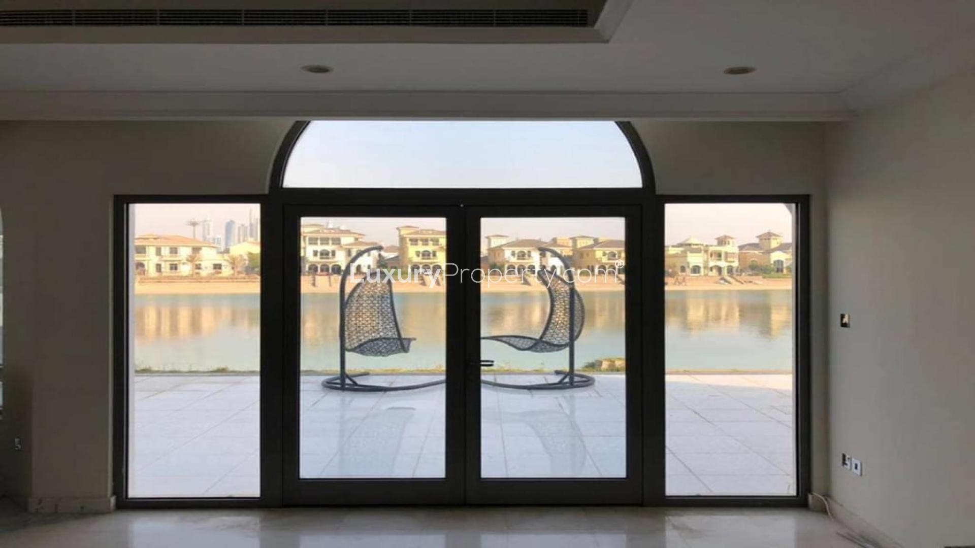 Elegant beachfront villa view with patio doors and waterfront on Palm Jumeirah