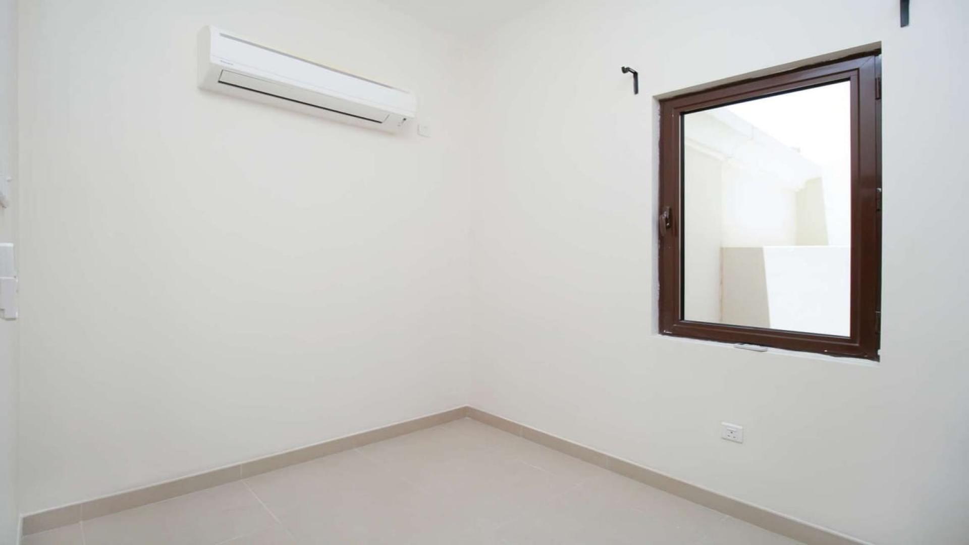 "Spacious 5-bedroom villa exterior in Lila, Arabian Ranches 2, ideal investment opportunity.",Empty room with window and air conditioning in Lila villa, Arabian Ranches 2