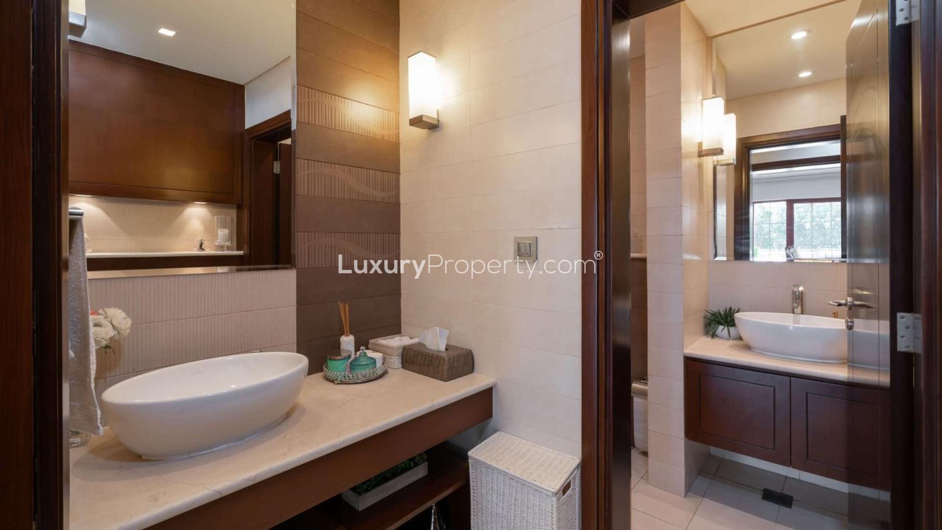 Luxurious bathroom in Jumeirah Islands mansion villa, featuring modern fixtures and elegant design
