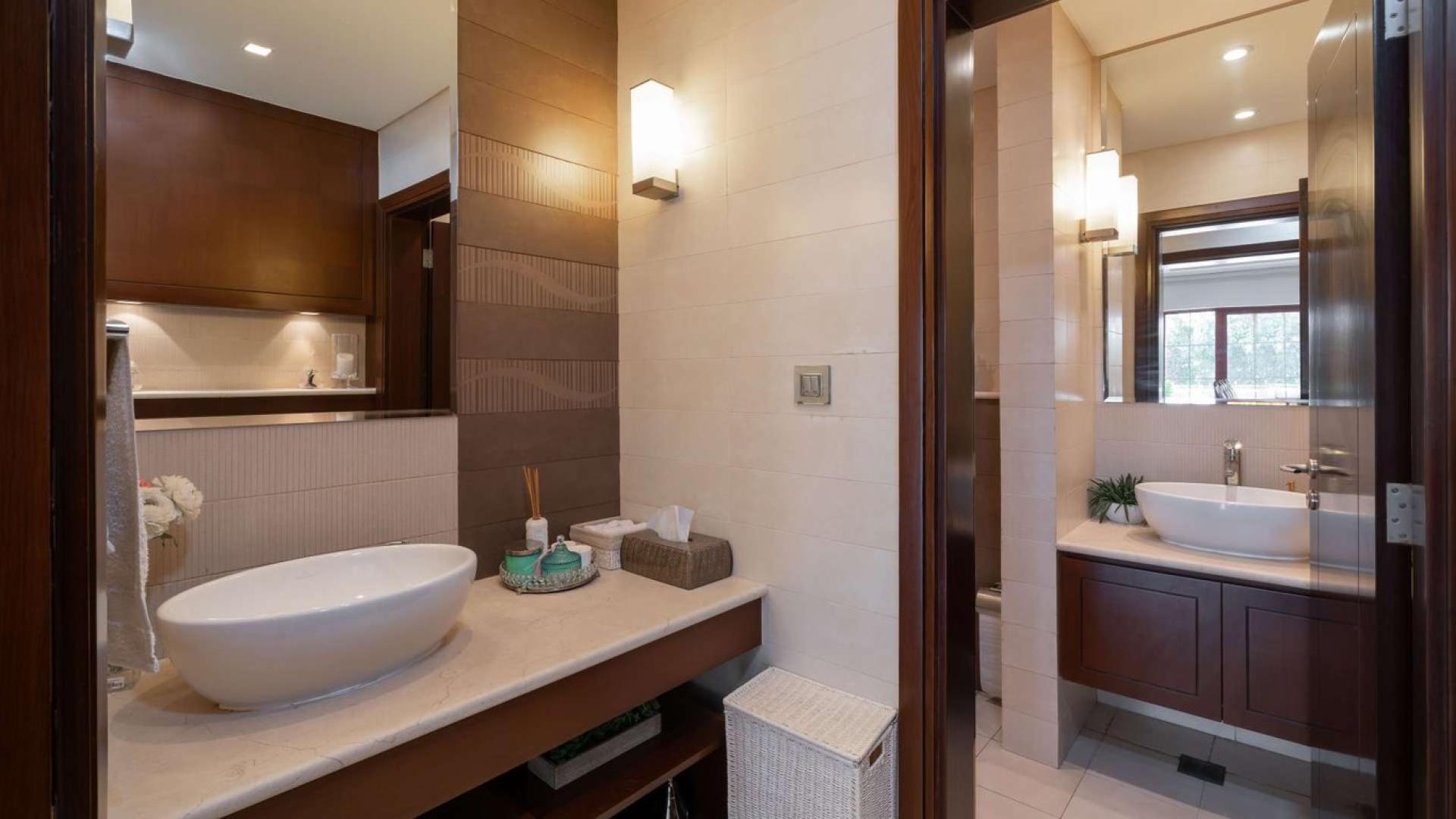 Luxurious bathroom in Jumeirah Islands mansion villa, featuring modern fixtures and elegant design