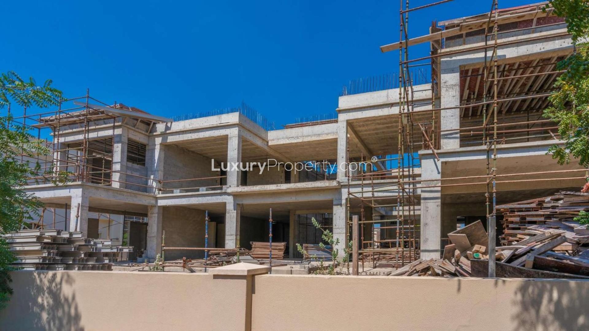 Villa overlooking lush golf course in Jumeirah Golf Estates, Earth community. Stunning view