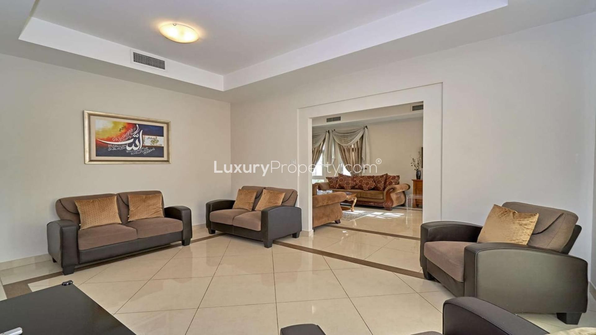 Living room in beautifully maintained 5-bedroom villa for sale in Naseem, Mudon community