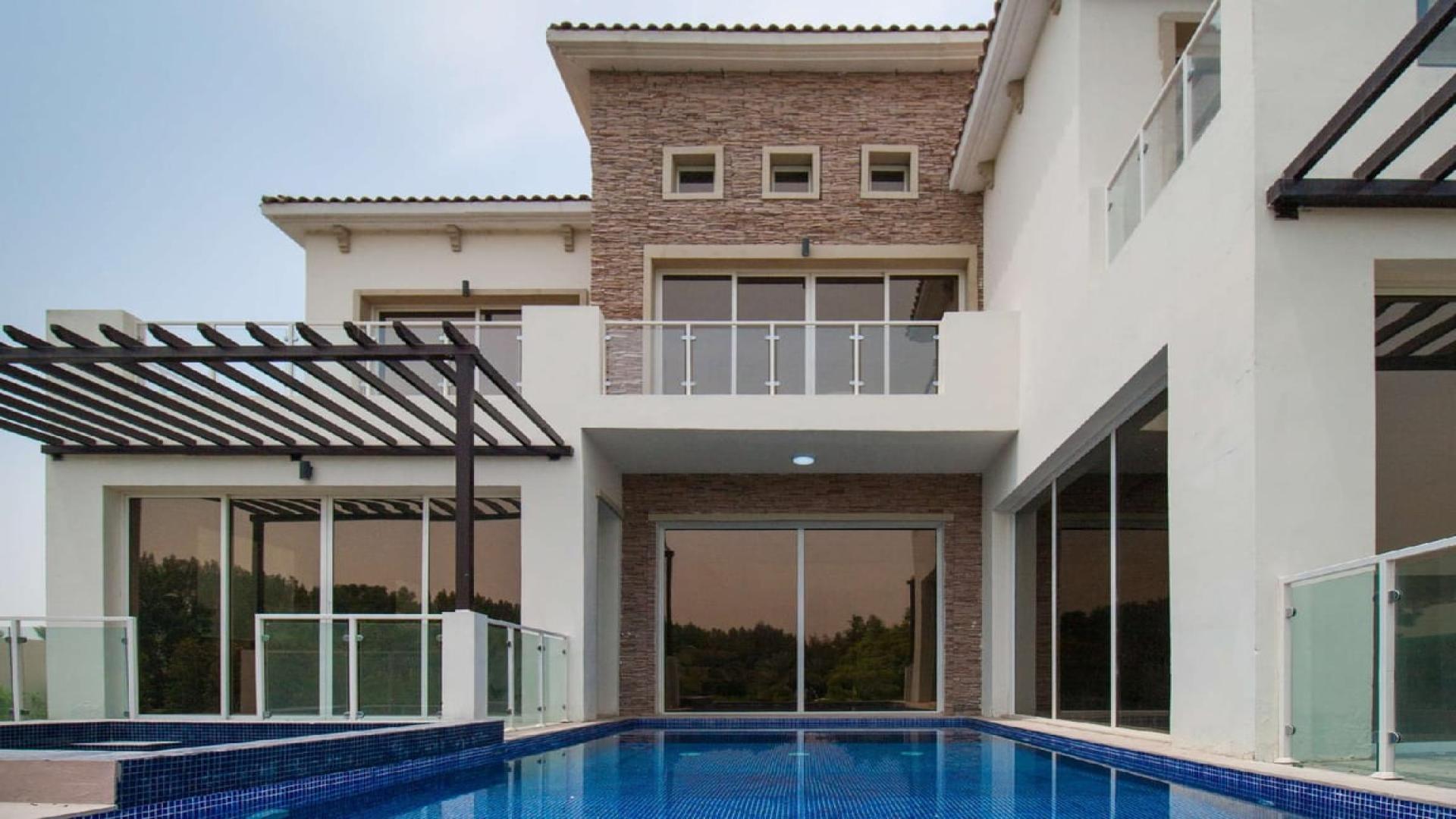 Modern atrium villa interior with pool view in Lime Tree Valley, Jumeirah Golf Estates