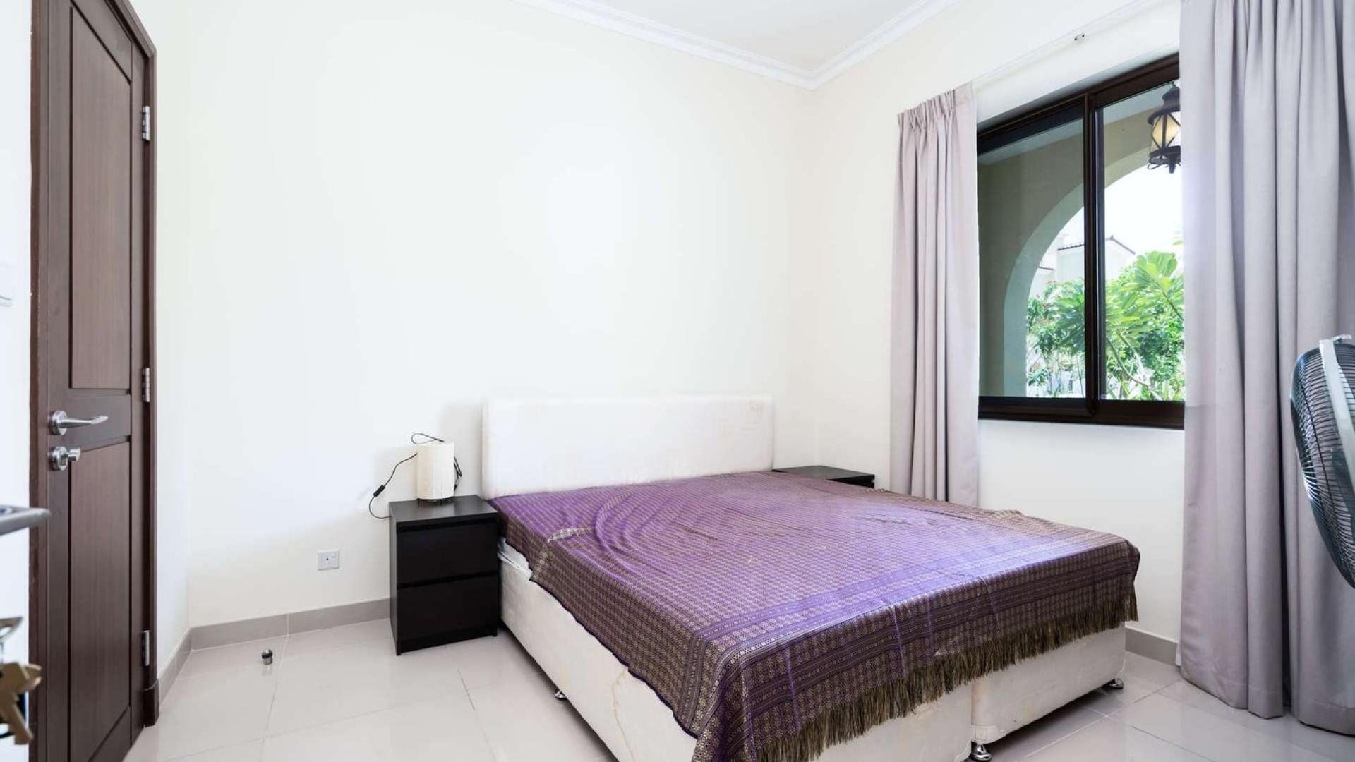 Living room in Samara villa, Arabian Ranches 2, with black sofas and modern decor