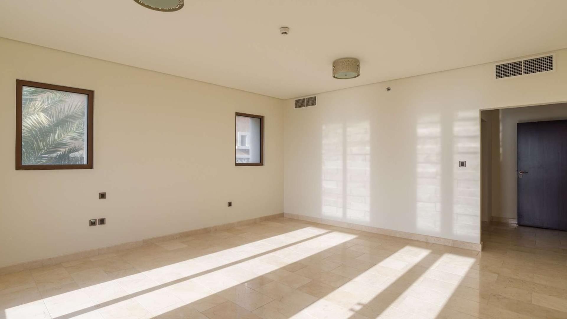 Spacious villa living room with pool view, Palm Jumeirah, Kingdom of Sheba