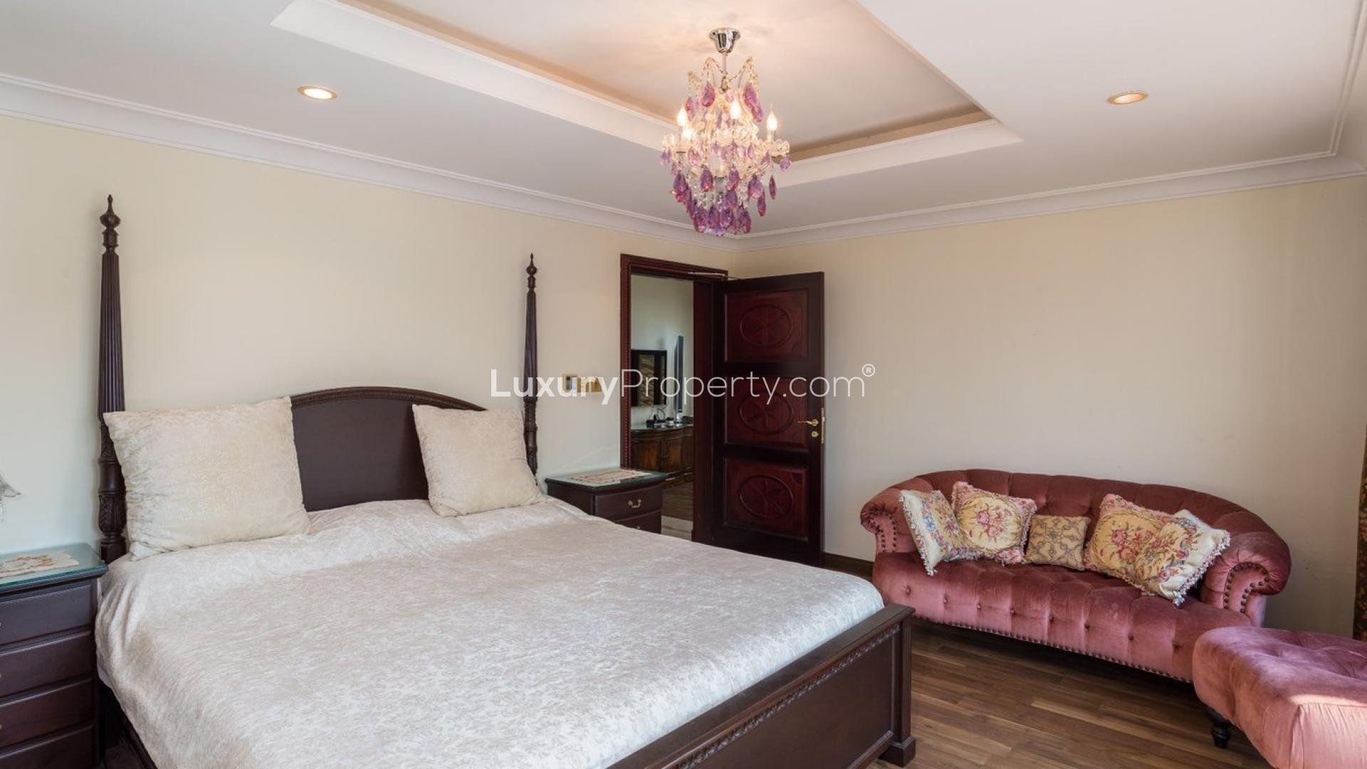 Luxurious dining and living area in Palm Jumeirah villa with pool view