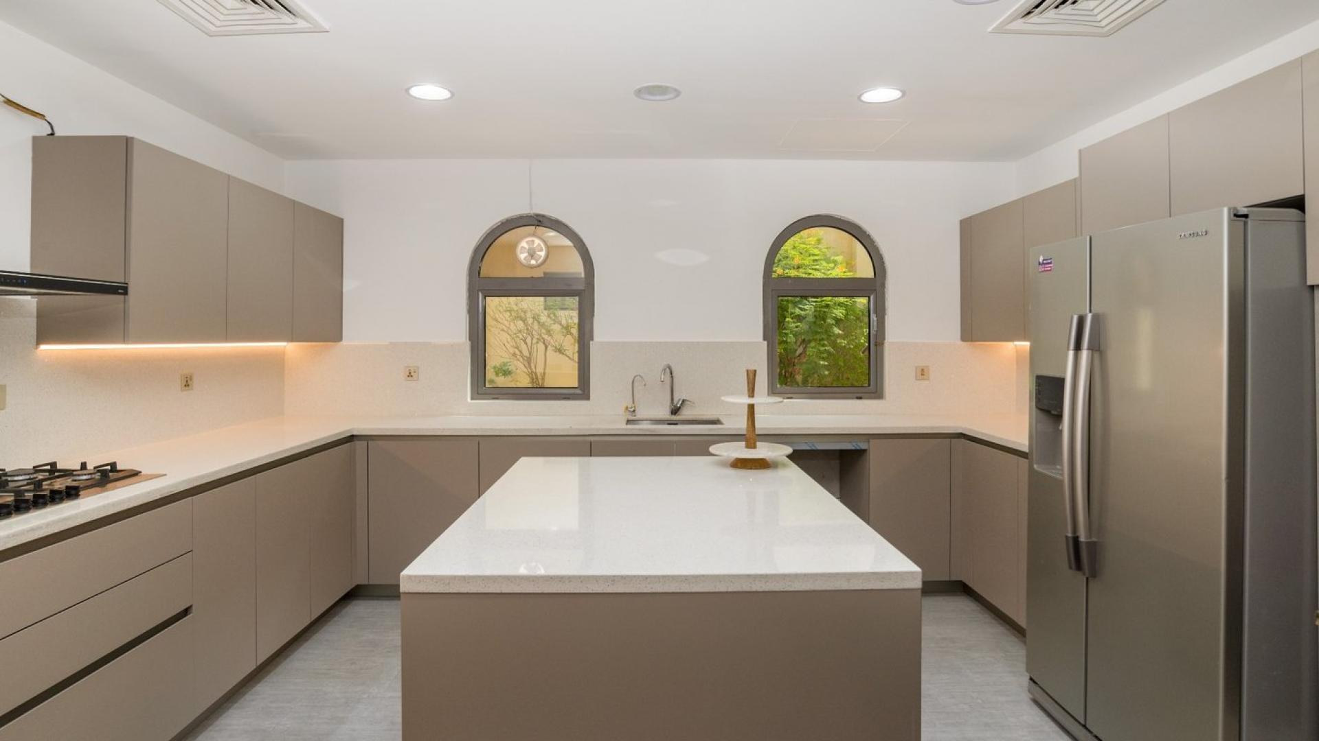 Luxurious living room in upgraded Palm Jumeirah villa with waterfront view and elegant decor