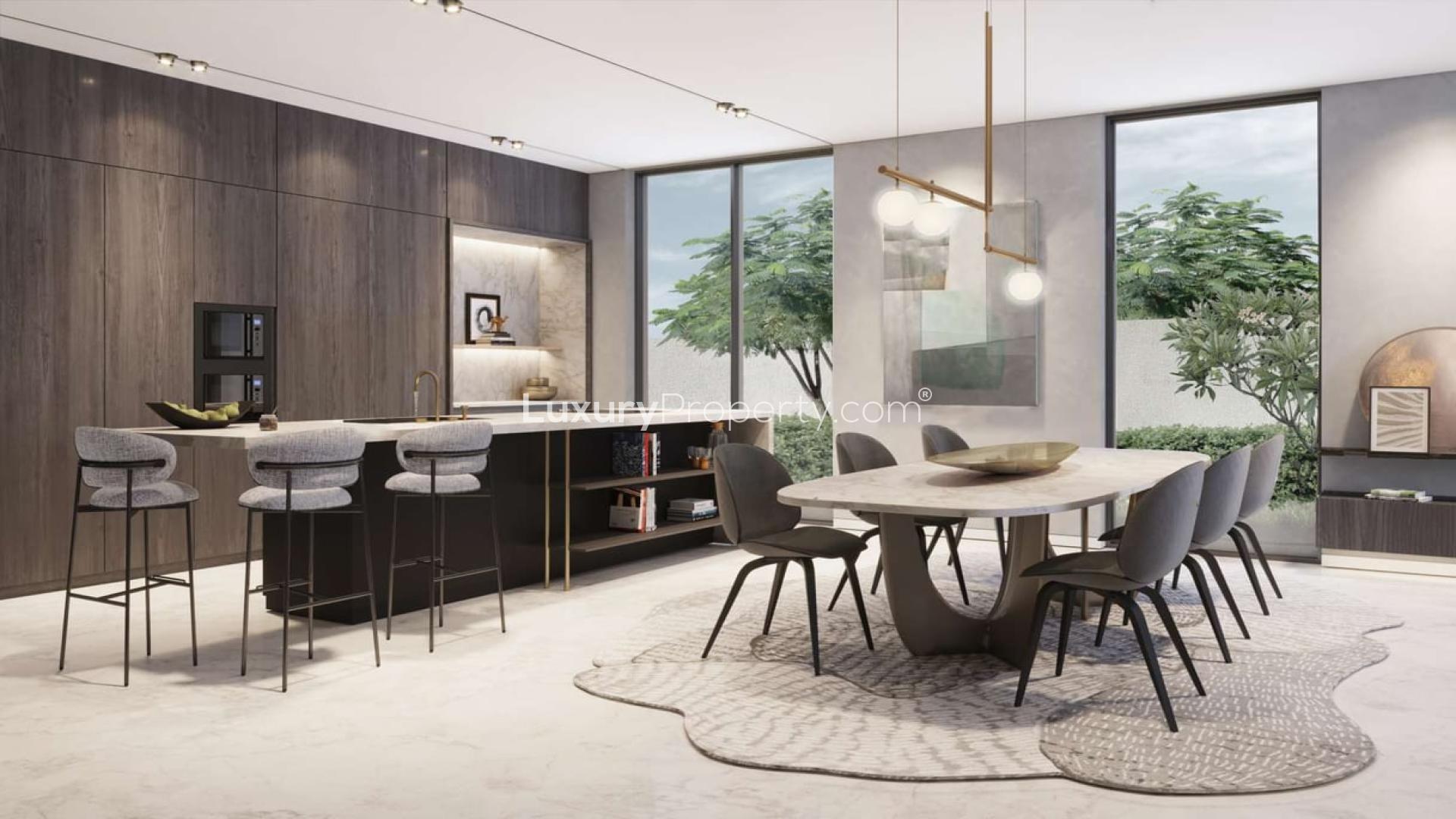 Modern villa exterior at Harmony III, Tilal Al Ghaf, featuring lush greenery and sleek design