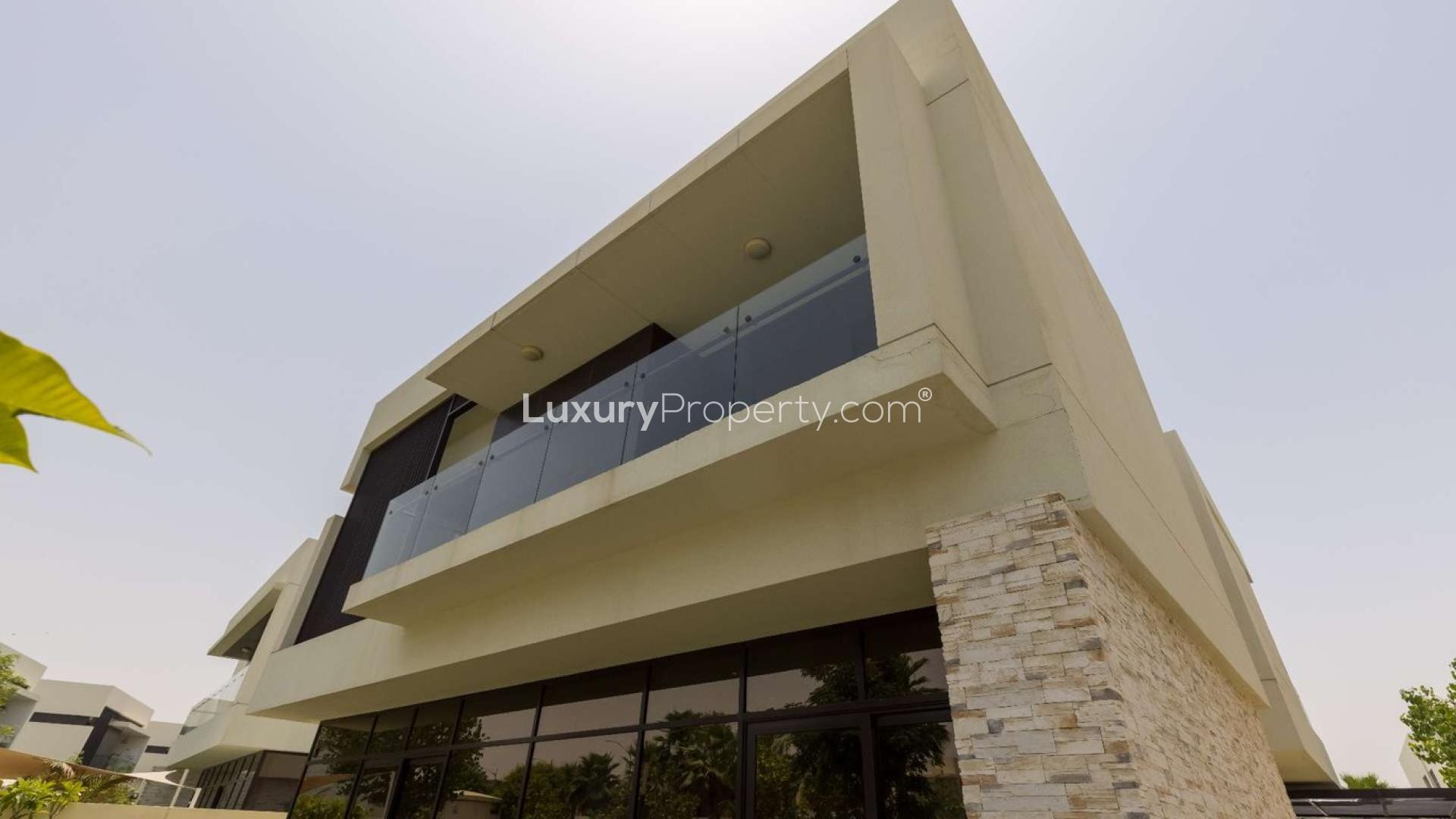 Modern living room in luxury Silver Springs villa, Damac Hills, with elegant decor and staircase