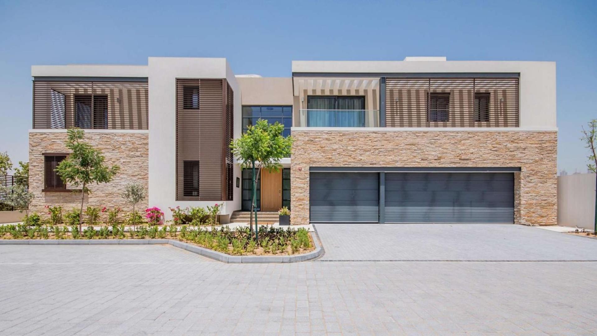 Luxurious living room in Sobha Hartland villa, featuring modern decor and large windows