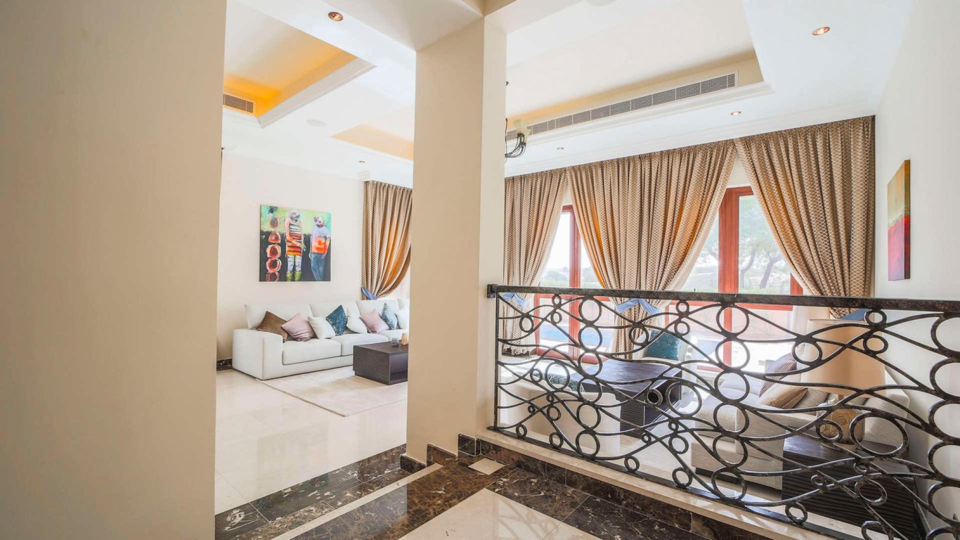 Luxurious living room in Orange Lake villa, Jumeirah Golf Estates, elegant decor and natural light