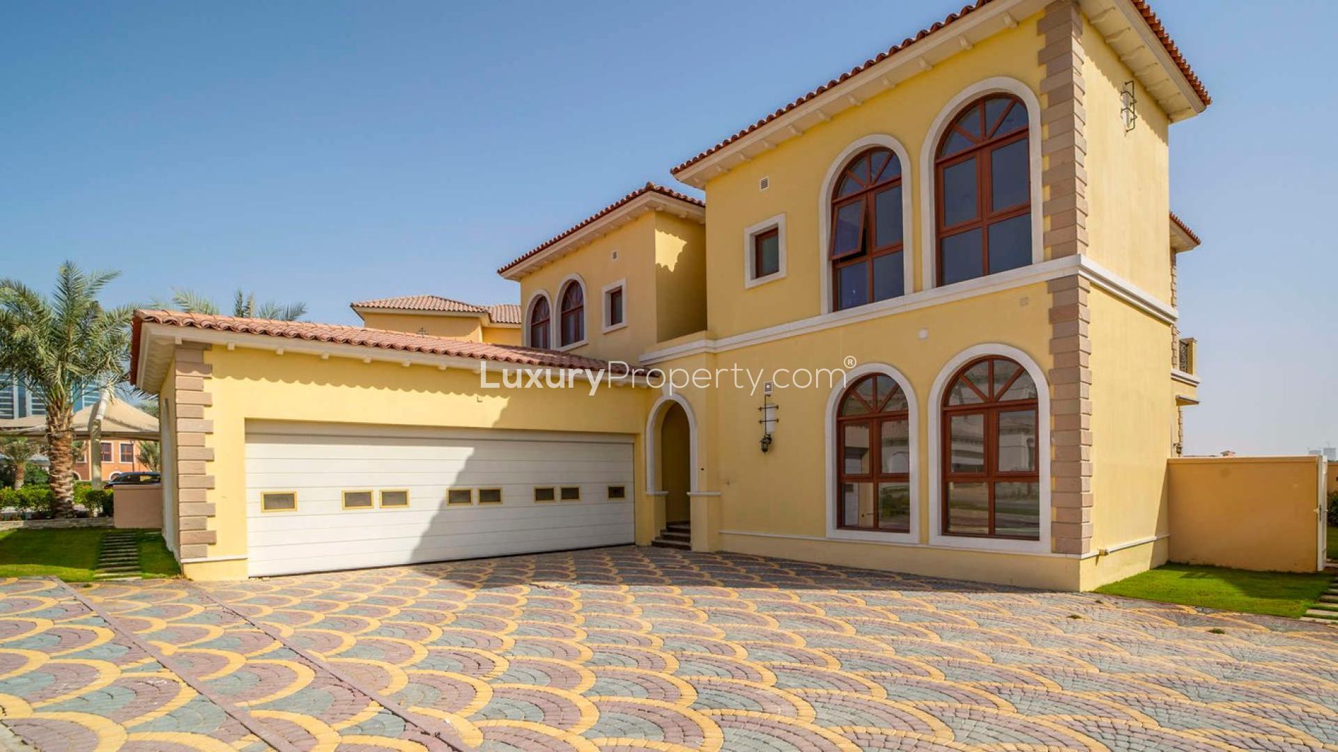 Luxurious living room in Orange Lake villa, Jumeirah Golf Estates, with elegant decor and furnishings